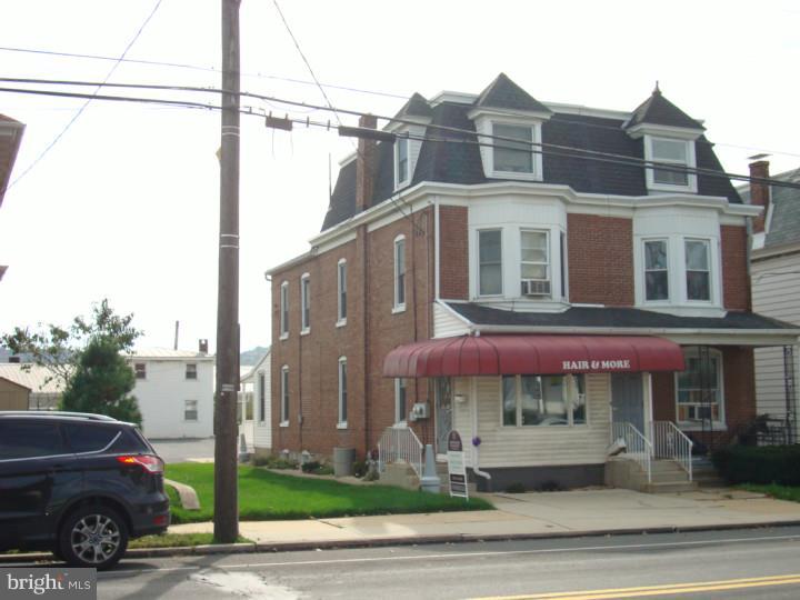 Beauty Shop on first floor. Apartment on second and third floors. Detached, two story, 2 car garage at rear alley. Apartment rented month to month at $500/mo. tenant pays gas and electric. Garage rented month to month at $125/mo. Property available at $119,900. or $121,500 with shop equipment - call for details. Nice up to date property with good Penn Ave. visibility - could be professional office. Eight car off street parking form rear alley.