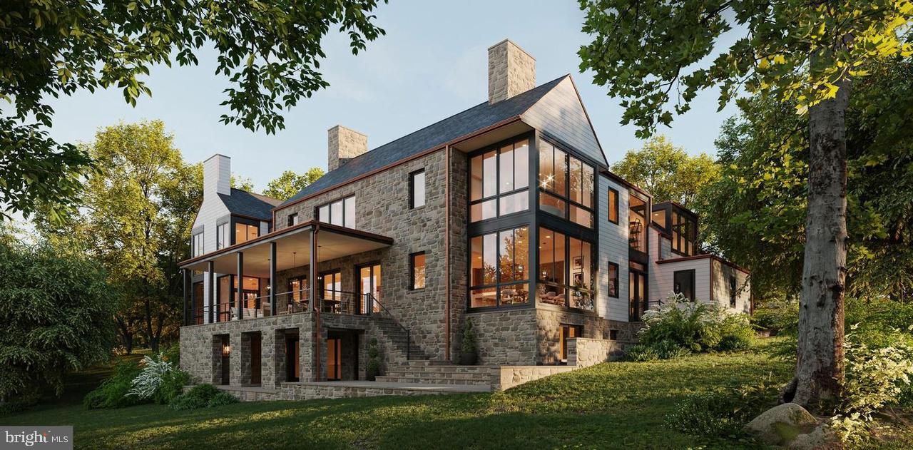 A striking new construction at 11520 Luvie Ct in
Potomac’s prestigious Merry Go Round Farm, this
9,000 sq. ft. modern estate is set on a prominent
.73-acre north-facing lot within the nation’s only
equestrian community along the Potomac River.
Surrounded by 202 acres of protected land and
8.8 miles of scenic bridle trails along the C&O
Canal, the home offers rare privacy and natural
beauty. Designed by world-renowned architect 
Jim Rill and built by award-winning AARDEN Homes,
the residence features soaring ceilings, expansive
walls of glass, and refined Western Maryland stone.
Highlights include an Architectural Digest–worthy
primary suite and a versatile loggia gym overlooking
tranquil horse-filled surroundings in this exclusive,
once-in-a-lifetime enclave.