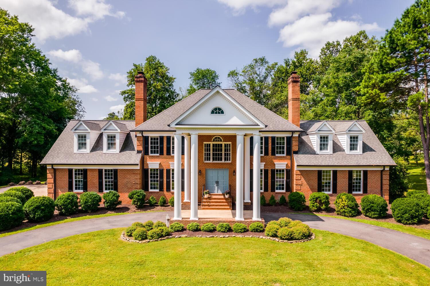Nestled on 11 scenic acres in a lush Virginia valley, this traditional Georgian estate offers exceptional privacy, timeless elegance, and peaceful countryside views, all with modern conveniences just minutes away. Located in the highly regarded Thunder Oak community, the property is set well off the road, where a long, tree-lined driveway leads to a classic circular drive and stately front entrance.
Enter through gorgeous double doors into a spacious main level featuring stunning hardwood floors, multiple family rooms, a formal dining room, and a spectacular back patio designed for effortless indoor-outdoor living. The updated gourmet kitchen is finished in a warm farmhouse style, blending charm and functionality. With an expansive 9-foot island, custom inlaid cabinetry, quartzite countertops, and reclaimed hardwood floors, this space is as beautiful as it is practical.
Upstairs, the expansive layout includes five bedrooms, three full bathrooms, attic access, and a formal den. The primary suite offers a thoughtfully designed, beautifully renovated bathroom. The upper second level features an additional bedroom with an en-suite bath, along with an adjacent room ideal as a library or office.
In addition to the 6-bedroom, 5-bath main residence, the property features a 3-stall barn complete with water and electricity. A sport court for pickleball or basketball and a private pond further enhance the property’s exceptional appeal.
Set in an area beloved for its beautiful rural scenery, Thunder Oak is especially popular with cyclists and outdoor enthusiasts, offering a picturesque country setting with convenient access to I-66, nearby amenities, and local destinations. The home is also within a short distance of The Winery at La Grange, adding to the unique lifestyle this exceptional property provides.
This remarkable estate is a rare opportunity to enjoy refined country living in an extraordinary setting. Welcome home to Thunder Road!