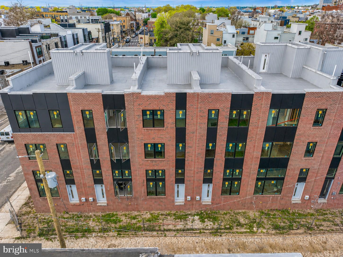 Welcome to Strata — a stunning new townhome development offering 1- and 2-car garage parking, ORIGINAL ten year tax abatement, and options to customize. These beautifully designed residences feature 3 bedrooms, 2 full bathrooms, and 2 half bathrooms, blending modern architecture with refined finishes to create the perfect balance of comfort and sophistication. 1338 S Woodstock Street is a highly desirable corner residence in the community, offering extra windows that fill the home with abundant natural light. This beautifully designed home features private one-car parking and a thoughtful layout that blends modern design with everyday functionality. The main living area impresses with its double-height ceilings and open-concept design, creating a bright and airy atmosphere perfect for both relaxing and entertaining. The living room flows effortlessly into a chef-inspired kitchen, complete with sleek slim-shaker cabinetry, quartz countertops, a spacious peninsula with barstool seating, and premium stainless steel GE Profile appliances—including a built-in microwave drawer and an exterior-vented hood. Buyers have the unique opportunity to personalize their home by selecting their own finishes. The adjacent dining area offers ample space for gatherings, highlighted by a dramatic glass wall that overlooks the living room below. Upstairs, the private primary suite spans its own level for ultimate comfort and tranquility. The spa-like bathroom, finished with elegant Porcelanosa tile, features a freestanding soaking tub, a large walk-in shower, double vanity, and private water closet, along with a generous walk-in closet. A conveniently located powder room on this floor is ideal for guest use. The upper level includes two additional bedrooms, a full bathroom, and a stylish dry bar—perfect for a morning coffee station or evening cocktail setup. Natural light from the pilot house brightens the entire stairwell and leads to the expansive rooftop deck, where you’ll enjoy breathtaking views of Center City, the Walt Whitman Bridge, and the nearby sports stadiums—making it the perfect setting for game days or hosting friends and family. Additional highlights include a full finished basement with high ceilings, ideal for a home office, gym, or flexible living space. Strata offers not only elevated living but also an exceptional location. Nestled in the desirable South Philadelphia area, residents are minutes from Passyunk Square’s vibrant restaurants and cafés, lively parks, and enjoy easy access to major highways and public transportation. Each home comes with a 10-year tax abatement and a 1-year builder’s warranty, providing peace of mind and exceptional value. Schedule your showing early to customize your finishes and make your dream home at Strata a reality. Taxes and square footage are the responsibility of the buyer to have verified independently. Renderings are for marketing purposes only and may not depict actual finishes.