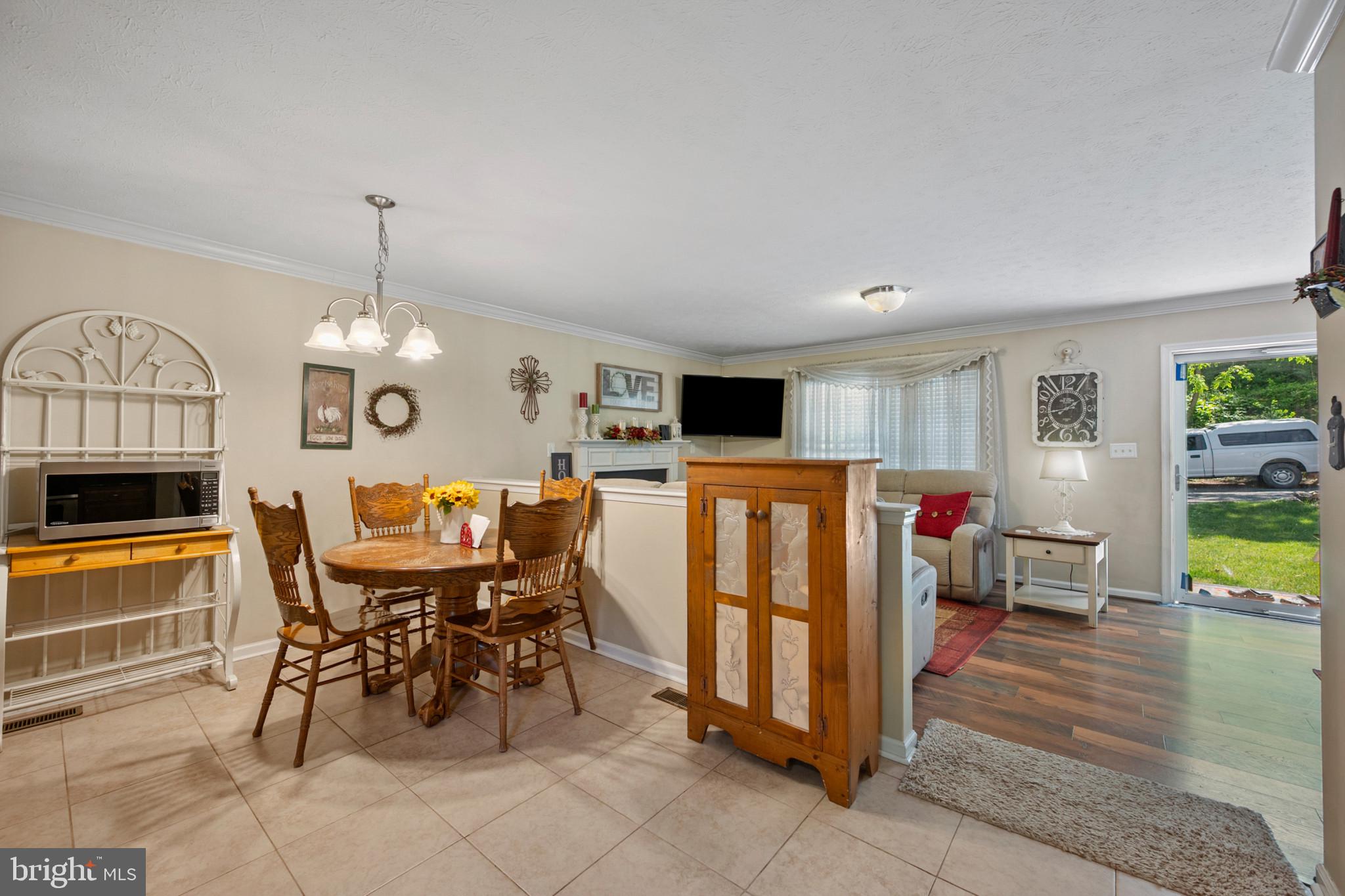 Charming ranch-style home nestled on a peaceful setting in Linden, VA. Offering over 1,700 sq ft on two finished levels, this home features a finished walkout basement with additional living space and flexible room options. Enjoy the welcoming front porch, spacious yard, and recent updates including renovated kitchen, newer flooring and screen door installed within the last three years. Septic system serviced within the last two years and well pump serviced approximately one year ago. Gutters recently cleaned. Conveniently located with easy access to I-66, wineries, hiking trails, and Shenandoah attractions. A great opportunity for buyers seeking comfort, privacy, and country charm.