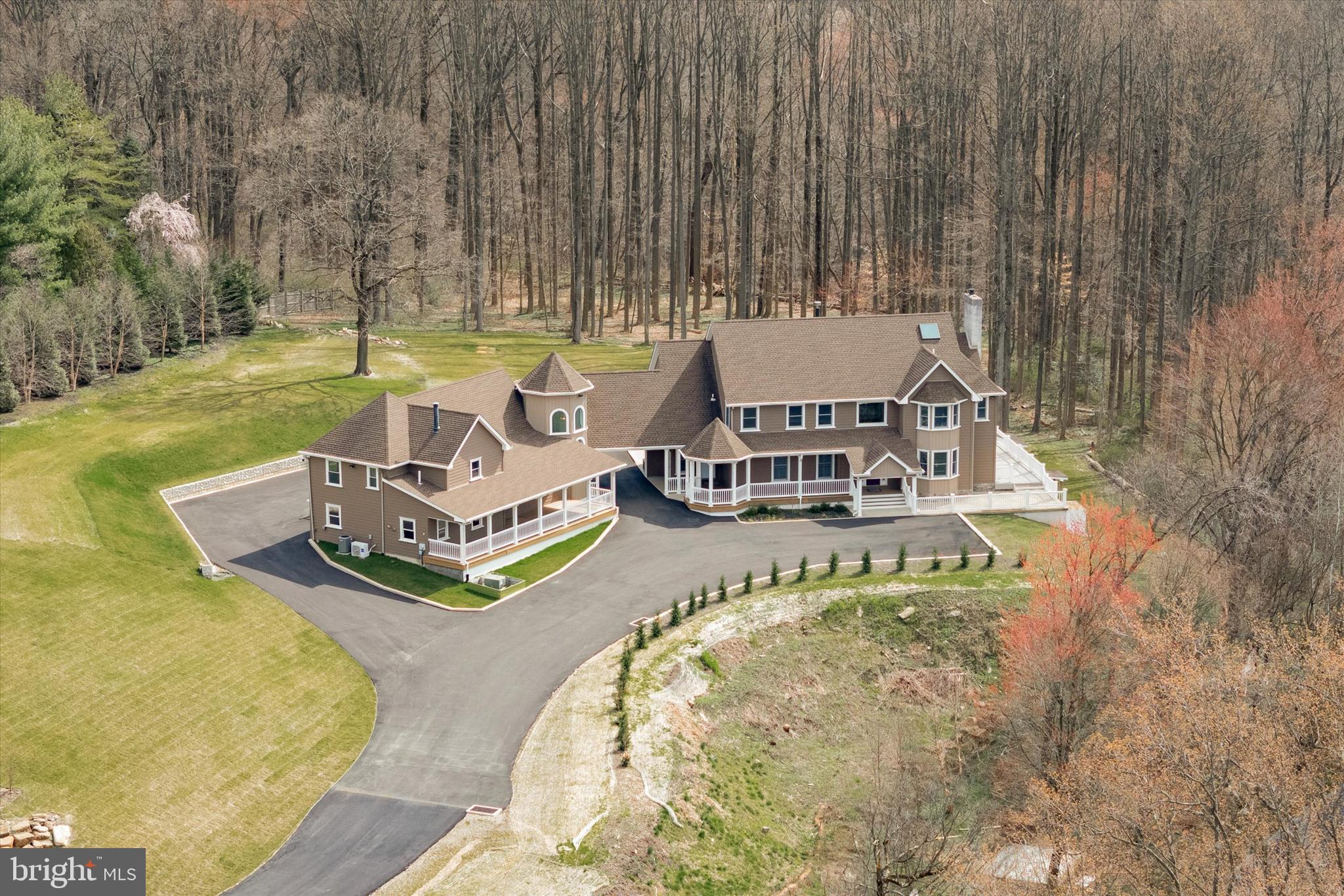 Meticulously Crafted Huntingdon Valley Hidden Gem Offers 5 Bed, 7 Bath, Private In-Law Suite and 3.3 Acres of Picturesque Views. Nestled in the heart of Huntingdon Valley, this custom-built colonial residence epitomizes the charm of country living while providing the convenience of in-town amenities. Step into the grand foyer, with its towering two-story ceilings and expansive windows, serving as the majestic gateway to the home. As you step inside, you're greeted by a sense of spaciousness and grandeur, with natural light streaming in through the surrounding windows, casting a warm glow across the meticulously designed space. The adjacent living room's décor is tastefully appointed with rich hardwood floors, trey ceiling with recessed lighting and intricate moldings; creating a seamless transition from the grand entrance to a welcoming space for relaxation and conviviality. Beyond the adjacent family room  the home unfolds into a sunken living room, complete with exposed beam, classic mantle and a magnificent fireplace, serving as the focal point of the room creating warmth and comfort. French doors adorn one side of the sunken L/R, leading out to a sprawling 1,400 sqft deck that wraps around the entire house. These doors provide seamless access to outdoor living spaces, blurring the boundaries between indoors and outdoors. The deck offers ample space for outdoor entertaining, dining, or simply soaking in the surrounding natural beauty. Top-of-the-line gourmet kitchen boasts a plethora of luxurious features for any cooking enthusiast. Among its highlights, 42' cabinets, crown molding, custom range hood, pot filler, double oven, 2 wine refrigerators, high-end appliances and a Grand island: spacious and functional centerpiece of the kitchen, ideal for food preparation, casual dining, and socializing while cooking. The formal dining room is the perfect space for family gatherings and memorable meals. Elegant primary suite is a haven of luxury featuring a fireplace, walk-in closet, double sink vanity, walk-in steam shower w/ seamless glass enclosure, modern tile, radiant floors and decadent carrera marble soaking tub; designed to offer an oasis of tranquility and indulgence. Completing the ensemble is a private 850 square foot deck, offering a secluded outdoor sanctuary where one can unwind and let the days stresses melt away. The open hallway leads to two additional bedrooms, each with its own en-suite bathroom, ceiling fans, walk-in closets, laundry room and private back stairwell. This setup offers privacy and convenience for guests or other members of the household who occupy these bedrooms. The walk-out basement has been updated with a fireplace, 2 full bathrooms, rec room, office, and game room. The large footprint offers possibilities for a wine cellar, office, fitness room, or additional storage space. In-Law Suite on the property is a rare gem that adds immense value and versatility to the living space. It's a feature that's seldom found and greatly sought after, offering the unique opportunity to accommodate loved ones or guests with comfort and privacy. Indulge in the privacy and convenience with your own separate entrance or access via an enclosed bridge from the main quarters. The open floor plan seamlessly integrates a spacious living room, dining area, kitchen, 2 bedrooms, 2 full bathrooms, finished rec room, front porch and private deck. creating an inviting ambiance for everyday living, gatherings and relaxation. The property is approved for 2 inground pools, a barn, and per township guidelines, up to 3 horses (1 horse per acre). The property offers the perfect blend of suburban tranquility and urban convenience with easy access to ; public transportation, hospitals, schools, airports, restaurants, shopping, golf courses and surrounding states; New York, New Jersey and Delaware! Contact us today to experience the unparalleled beauty and sophistication this property has to offer.