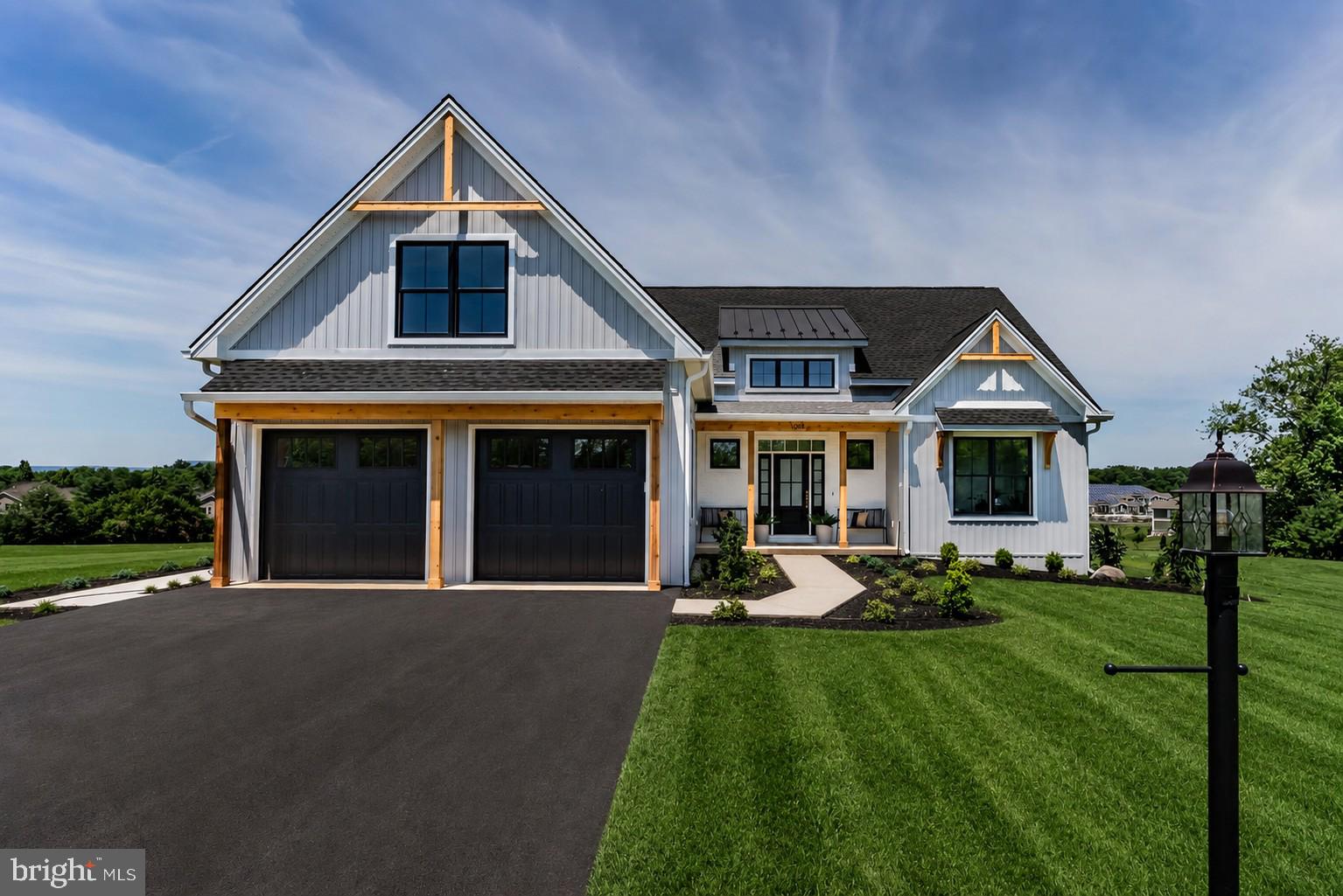 Luxury Custom Home in South Middleton School District

Experience exceptional craftsmanship and elevated living in this stunning custom-built Musser Home Builders home offering 4 bedrooms, 3 full bathrooms, and 2,763 square feet of thoughtfully designed living space. This home seamlessly blends luxury finishes, energy-efficient construction, and timeless architectural details.

From the moment you arrive, you’ll appreciate the home’s striking curb appeal featuring a beautiful combination of brick, cedar, and vinyl siding, a welcoming covered front porch, insulated garage doors, and a premium architectural roof with standing seam metal accents. Step inside to discover soaring 15 ½ foot vaulted ceilings with exposed rafters, rich engineered hardwood flooring, custom millwork, and an abundance of natural light throughout.

The heart of the home showcases custom cabinetry, granite countertops, premium GE appliances, a built-in coffee bar, and stunning craftsmanship around every corner. The spacious great room features a dramatic double-sided brick fireplace that extends to the covered rear porch, creating the perfect space for both everyday living and entertaining. The luxurious first-floor primary suite offers a 13 foot vaulted ceiling, custom walk-in closet, and a spa-inspired bathroom with a curb-less tile shower.

Additional highlights include custom tile work, solid-core interior doors, crown molding, built-in features, upgraded plumbing fixtures, and granite and quartz countertops & extensive closet organization systems throughout. Built with quality and efficiency in mind, the home features Weather Shield Signature Series windows, Therma-Tru exterior doors, superior insulation, a two-zone natural gas HVAC system, whole-house humidifier, ERV system, electronic air filtration, and energy performance that exceeds building code standards.

Enjoy peaceful evenings on the covered rear porch complete with a brick fireplace and beautiful mountain views. This is a rare opportunity to own a meticulously crafted custom home where luxury, comfort, and quality construction come together in one exceptional package. A home of this caliber is more than just a place to live—it’s a lifestyle.
