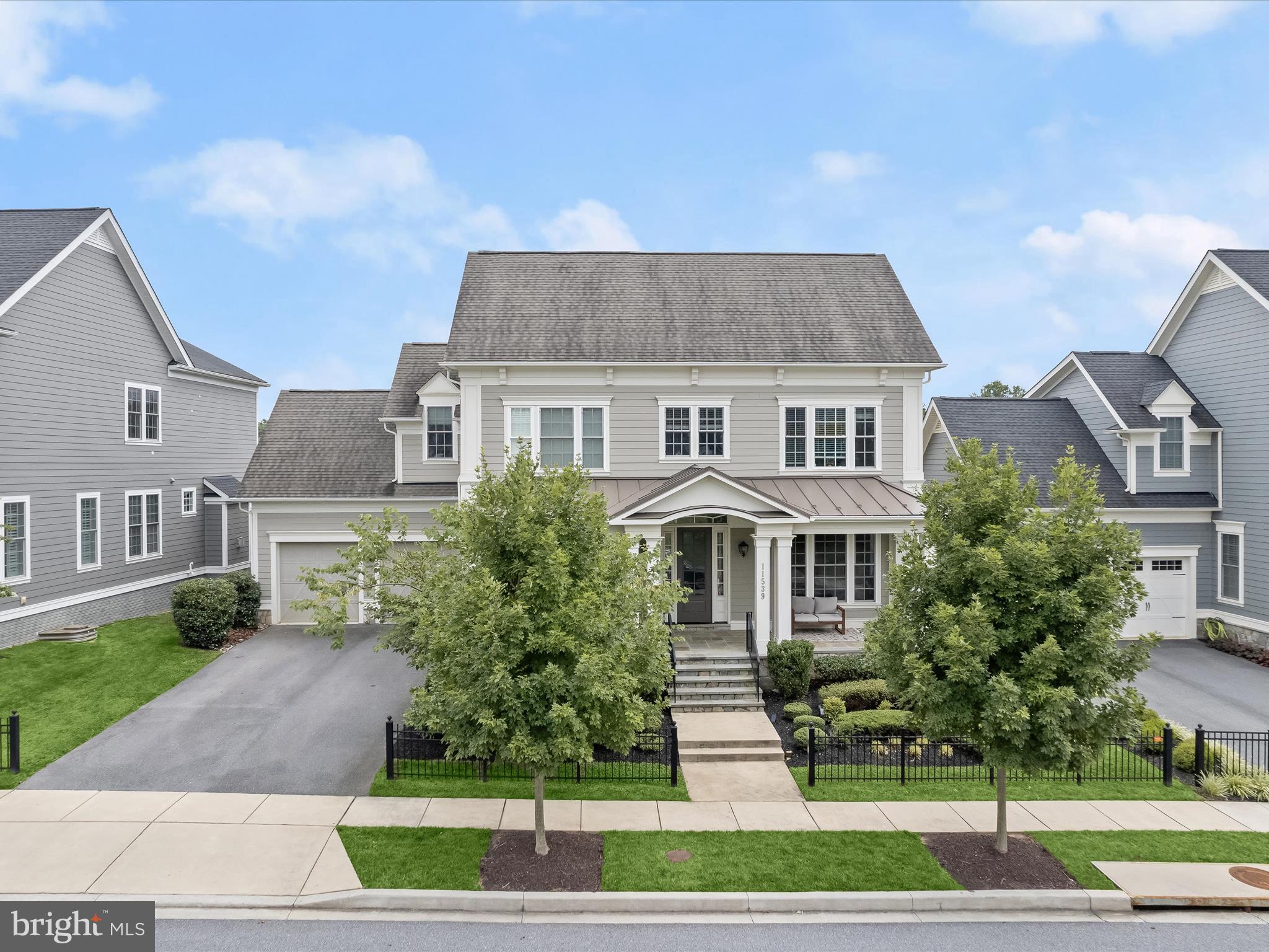 Welcome home to 11539 Iager Boulevard in Howard County’s most sought-after community: Maple Lawn! This fully loaded stunner by esteemed builder Mitchell & Best is located in Maple Lawn’s exclusive Garden District. Featuring the ever popular Hamilton II floorplan, this premier Maple Lawn offering is a benchmark of refined quality, style and taste. Highlights include the sprawling TREX deck, walk-out basement, bright white chef’s kitchen, custom window treatments and an expansive back yard which backs to conservation area. Lots like this one are a rare find in the neighborhood. 

Meticulous landscaping and a full-width flagstone front porch invite you inside the main level. A magazine-worthy kitchen awaits with shaker-style cabinetry extending to the ceiling, double ovens, 6-burner cooktop and eat-in kitchen area. The kitchen is connected to the formal dining room by the functional and beautiful butler pantry. The formal living room boasts a stone gas fireplace and large windows allowing a pristine view of the nature preserve outside. 

A large sitting area greets you at the top of the upper level landing. All four spacious bedrooms are located on the upper level and the primary suite features a tray ceiling, recessed lighting and a huge walk-in closet. The primary bathroom boasts two large vanities as well as a lavish walk-in shower and soaking tub. The lower level provides another large family entertainment area with a walk-out sliding door and large windows allowing an abundance of natural light. A gym and an additional full bathroom are also located downstairs. 

This rare opportunity presents the perfect blend of a serene, private, manor-like setting yet you’re still just a short walk from all the conveniences this award-winning, expertly planned community has to offer. Zoned for highly rated Howard County Schools, conveniently located close to all major Baltimore/DC commuter routes, and with enviable amenities including a resort-style community pool, tennis courts, pickleball courts, basketball courts, state-of-the-art gym and more, you’ll quickly see why Maple Lawn is one of the most sought-after communities in the region and why 11539 Iager Boulevard is truly one of its finest, flagship residences.
