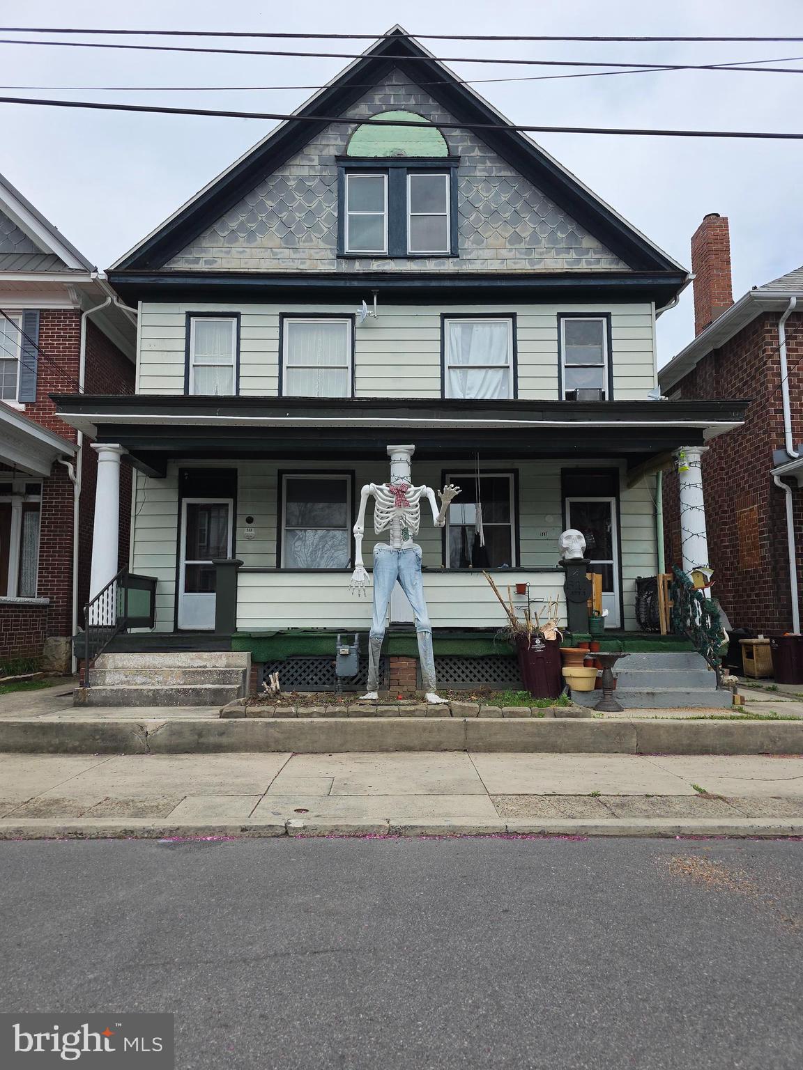 THIS IS A FIVE  UNIT APARTMENT BUILDING!!! P&L statements are available. Pre-qual letter requested prior to showings. The property contains 4 one bedroom apartments and a charming garage apartment situated overtop of a large garage. Live in the back and let the 4 units pay the mortgage.