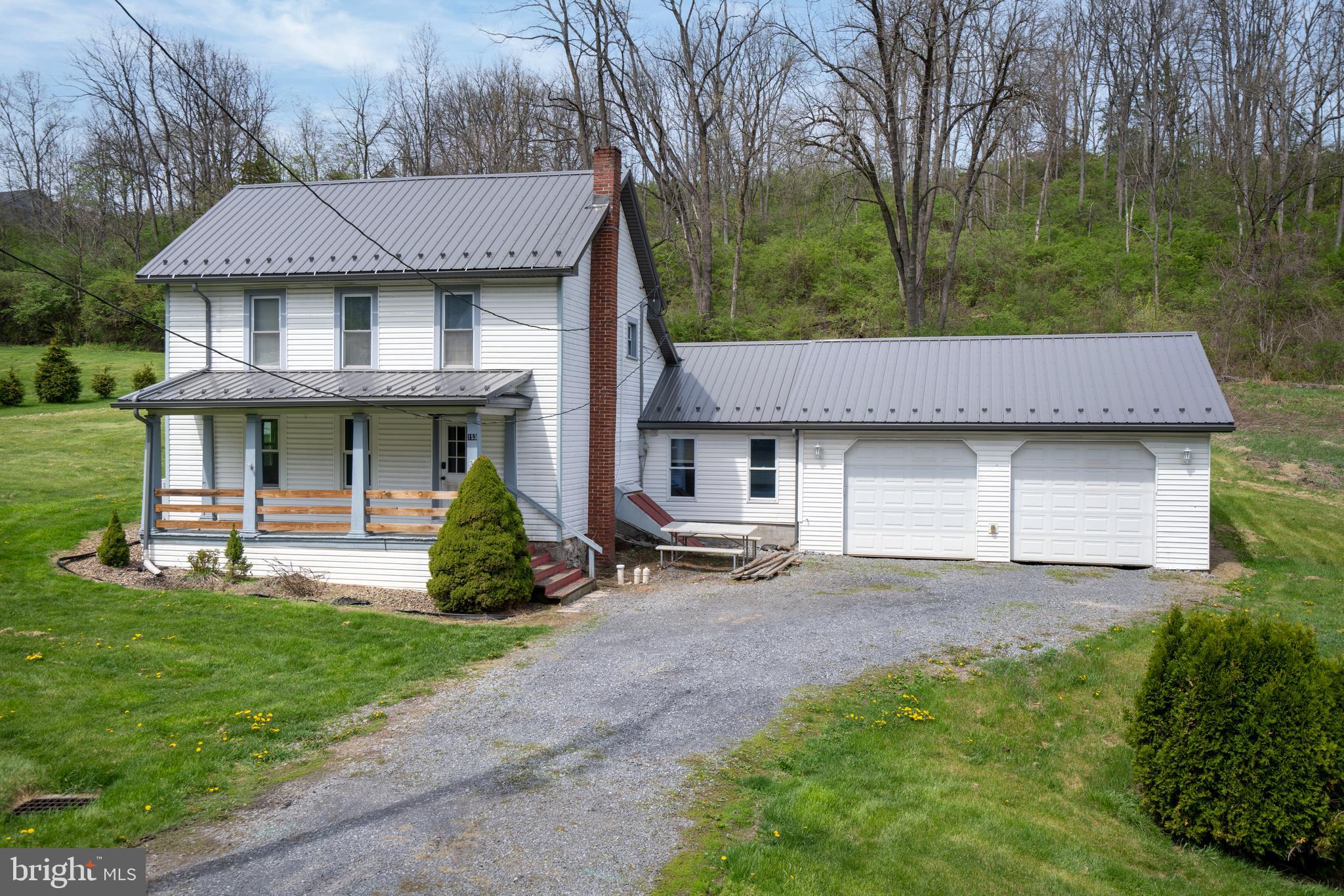 Welcome to this inviting 3-bedroom, 2 full bath home on 3.18 acres, offering the perfect combination of country living, modern updates, and versatile space. Nestled on a scenic, private lot, this move-in ready property provides both comfort and functionality with room to grow. Inside, you’ll find an updated kitchen featuring recessed lighting, new plank flooring, and modern finishes, along with some updated appliances. The main floor full bath has been tastefully updated, adding convenience and style. A bonus room offers flexibility as a 4th bedroom, home office, or guest space, making this home ideal for a variety of lifestyles. An attached 2-car garage provides added convenience and functionality. Stay comfortable year-round with a mini ductless split system for efficient heating and cooling, while enjoying the durability and value of a metal roof on both the home and barn. Step outside to relax on the charming front porch or take advantage of the expansive property. The barn provides additional parking, storage, and a finished room with electric and heat, perfect for a workshop, studio, or hobby space. With open space, privacy, and endless possibilities, this property is ideal for those seeking a peaceful country setting while still being within reach of local amenities. Don’t miss this rare opportunity to own acreage with modern updates and outbuildings—schedule your private tour today!