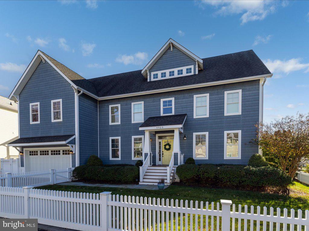 Located just an hour from Washington, D.C., this custom-built waterfront estate on Chesapeake Bay offers a rare blend of modern luxury, serene views, and premier water access, making it the perfect retreat or high-potential vacation rental. At nearly 5,000 square feet, this thoughtfully designed home captures the essence of relaxation and recreation along over 100 feet of pristine shoreline.

Built with gatherings in mind, this three-level residence features 4 spacious bedrooms and 4.5 refined bathrooms, making it a perfect choice for family vacations or group getaways. The main level showcases an open-concept design with soaring ceilings, rich maple hardwoods, and a striking stone-surround fireplace as the focal point of the living room—a welcoming feature for cozy evenings and gatherings. The gourmet chef’s kitchen is outfitted with premium stainless steel appliances, double ovens, a gas cooktop, and granite countertops, while an adjoining screened-in porch offers a peaceful, sheltered space to enjoy Bay views over morning coffee or evening drinks.

Each level of the home presents thoughtfully designed spaces for both entertainment and relaxation. The second-floor owner’s suite is a private sanctuary, complete with a spa-like bath, sitting area, bonus room, and a private balcony overlooking the Bay’s tranquil waters. Additional guest suites and a cozy den provide ample space for unwinding, while a main-level office offers a secluded retreat for work or planning the day's adventures.

The third floor is dedicated to entertainment, with a spacious family room featuring a wet bar, refrigerator, and balcony offering panoramic views—an ideal spot for sunset gatherings or lounging after a day on the water.

Outside, lush lawns lead to a custom pier with dual boat lifts, making water adventures effortlessly accessible. A private waterside entrance and full bath provide a convenient transition from outdoor fun to indoor comfort.

Perfectly positioned for vacation rentals, this move-in-ready property is within reach of local amenities like a marina, boat ramp, swimming beach, and popular waterfront restaurants accessible by boat. Whether as a private retreat or an income-generating rental, this property offers a luxurious Chesapeake Bay lifestyle with proximity to the city and high demand for a premium waterfront experience.