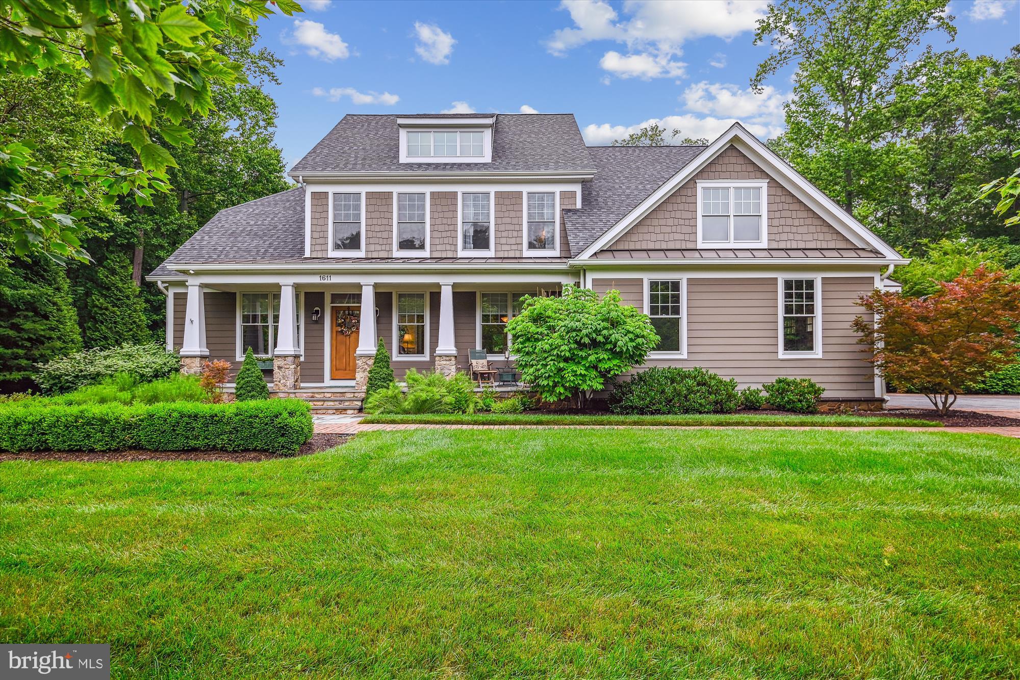 Nestled in the prestigious Misty Manor community, this exquisite Colonial residence offers a harmonious blend of luxury and comfort, set on a sprawling 2.09-acre lot that backs to serene woodlands. Built in 2014, this home showcases impeccable craftsmanship and high-end finishes throughout, creating an inviting atmosphere that feels like a retreat. Step inside to discover a thoughtfully designed open floor plan that seamlessly connects the gourmet kitchen, dining area, and family room. The kitchen is a culinary enthusiast's dream, featuring upgraded countertops, a spacious island, and stainless steel appliances, including a double oven and built-in range. Enjoy casual meals in the breakfast area or entertain guests in the formal dining room adorned with elegant chair railings and crown moldings. The main level also boasts a cozy family room with a gas fireplace, perfect for gathering on chilly evenings. Large windows bathe the space in natural light, while recessed lighting adds a touch of sophistication. The primary suite is a true sanctuary, complete with a luxurious en-suite bathroom featuring a walk-in steam shower and ample closet space. Venture downstairs to the partially finished basement, which offers endless possibilities with a walkout entrance. This versatile area is perfect for a home theater, gym, or guest suite. Outside, the property is a true entertainer's paradise. The extensive hardscape surrounds a heated in-ground pool, dramatic water feature/fountain  complemented by a hot tub for ultimate relaxation. The beautifully landscaped yard features underground sprinklers and a charming screened cabana/pool house. Enjoy peaceful evenings on the screened porch or patio, surrounded by the tranquil sounds of nature. Additional highlights include a side-entry garage with ample parking, a sound system throughout the home, and energy-efficient features such as low-E windows.
The sellers built an additional oversized 2 car detached garage with floored attic space..  The scenic vistas and wooded views create a picturesque backdrop, enhancing the exclusive lifestyle this property offers. Experience the perfect blend of luxury, comfort, and nature in this stunning Misty Manor home, where every detail has been meticulously crafted for your enjoyment!