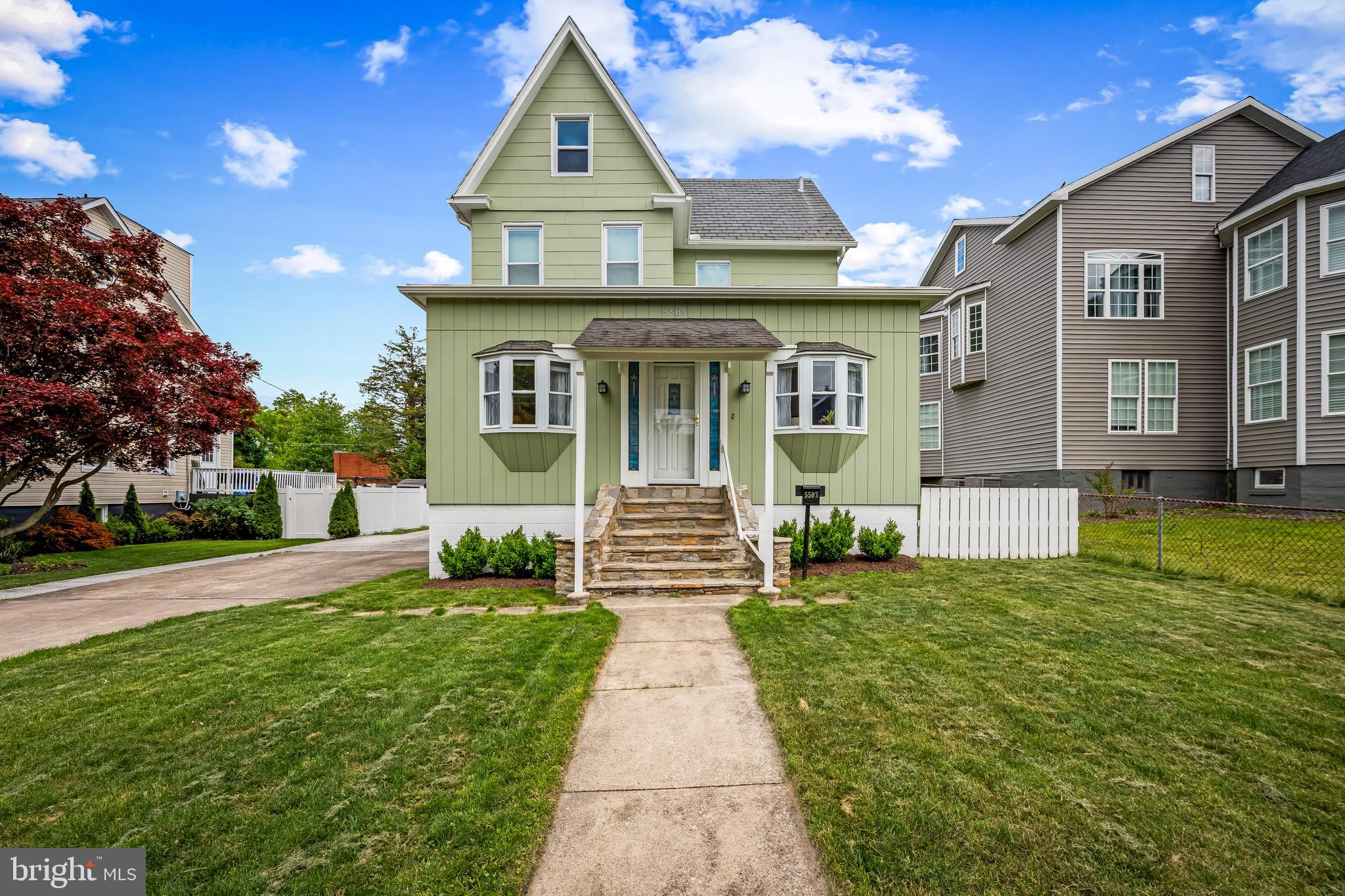 Welcome to this beautifully updated Hamilton Lauraville home in Northeast Baltimore, offering the perfect blend of Baltimore City living and a suburban neighborhood feel. Situated on an extra large level lot with extensive off street parking, fenced yard, covered deck, and flexible living space, this move in ready property is a rare find in one of Baltimore’s most sought after communities. As you enter the home, you are welcomed into the owners’ beloved “Sporch,” an enclosed sunroom porch that serves as an inviting extension of the living space and the perfect spot for morning coffee, family meals, casual gatherings, or relaxing evenings with friends. Beyond the Sporch, a foyer opens into a spacious living room featuring charming built ins, refinished original hardwood floors, and thoughtfully coordinated oil rubbed bronze fixtures and hardware selected to complement the home’s 1914 character. Original and updated period appropriate six inch base moldings throughout the home further enhance its timeless architectural appeal. Just off the kitchen is a practical mudroom and full bath, creating an ideal everyday layout. At the rear of the home, a large covered deck overlooks the expansive level backyard, offering exceptional space for entertaining, gardening, pets, outdoor dining, and summer barbecues. The second floor features three comfortable bedrooms and a full bath, along with original second floor hall doors complete with charming vintage hardware that elegantly separate the bedroom area. Original and period appropriate five panel doors throughout the upper level help preserve the home’s architectural integrity. A beautifully researched stained glass front door, believed to be true to the home’s original 1914 design, further enhances the property’s timeless character. The unfinished basement offers abundant storage and laundry space. The home is kept comfortable during the summer months with window air conditioning units. Meticulously maintained and extensively updated over time, this home reflects true pride of ownership throughout. No stone has been left unturned, allowing buyers to move in with confidence knowing the property has been carefully improved and exceptionally cared for. Located in the heart of Hamilton Lauraville, this home offers easy access to downtown Baltimore, Towson, Johns Hopkins, Morgan State University, I 695, and I 83.Enjoy nearby neighborhood favorites like Zeke's Coffee, Domesticity, Snug Books, Wax Atlas Record and Stereo Exchange, and Koco's Pub. Outdoor enthusiasts will also appreciate close proximity to Herring Run Park, a 375 acre urban oasis with wooded trails, streams, athletic fields, and green space rarely found so close to the city. Owners would like a quick closing with occupancy through July 15, 2026.
