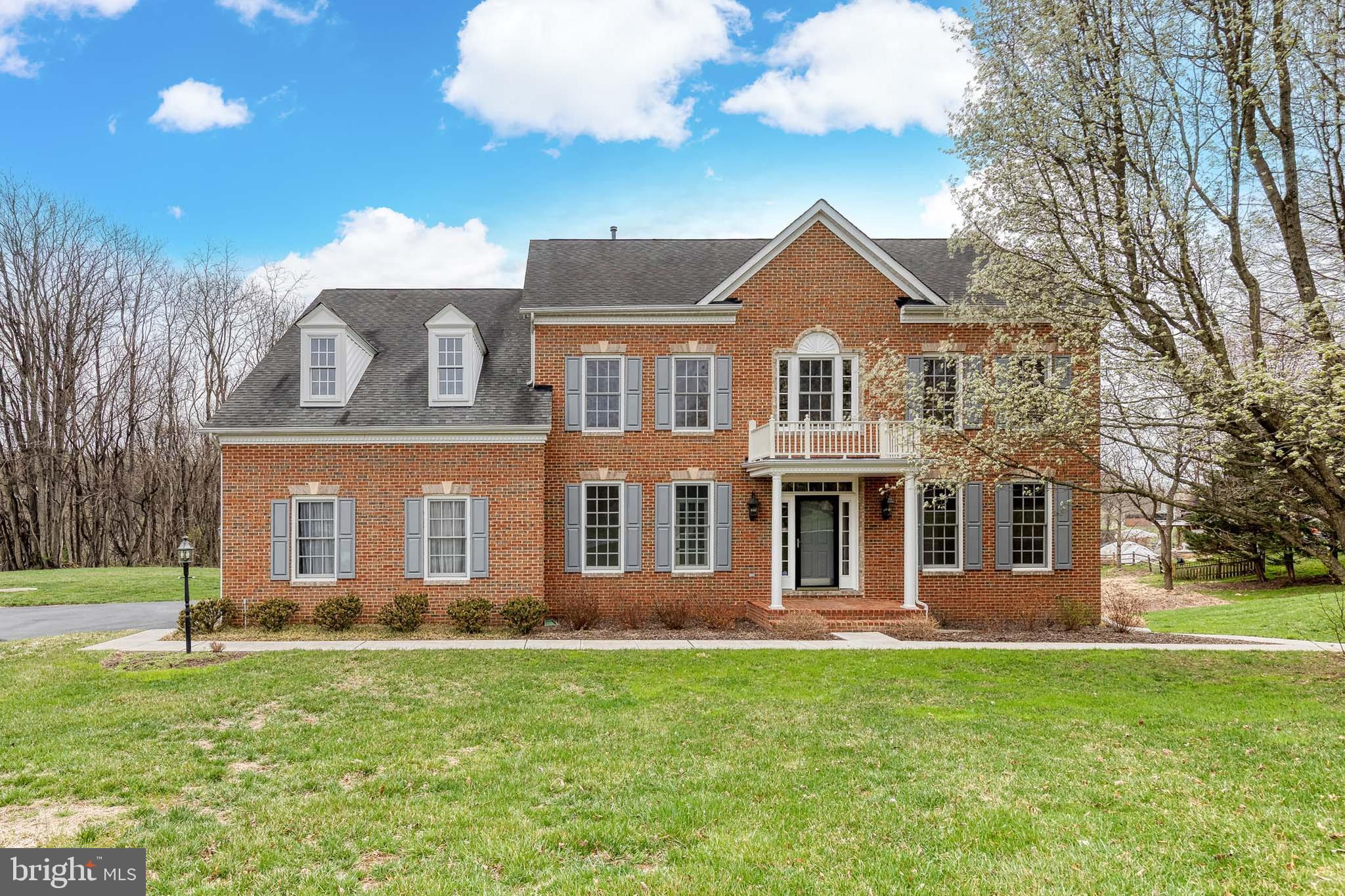 Stunning colonial brick front home nestled in the highly desirable Hayfields Manor.  This exceptional single-family home is surrounded by picturesque conservancy land, offering both privacy and natural beauty. Immaculately maintained and flooded with natural light, this spacious home boasts 4 levels, 6 bedrooms, 5 full bathrooms, and powder room, providing ample room for comfort and functionality.  Upon entering, you're greeted by newly refinished hardwood floors that flow seamlessly throughout the main level. The brand-new, remodeled gourmet kitchen is a chef’s dream, featuring a professional Monogram range/oven, glass hood, quartz countertops, stainless steel Monogram Advantium microwave, and a Monogram wall oven with Wi-Fi and voice control. The kitchen also features an under-mount workstation sink and custom shaker cabinets. Adjacent to the kitchen is a bright family room with a cozy gas fireplace, and a breakfast room with vaulted ceilings—perfect for enjoying your morning coffee. The main level also offers a formal living room and dining room, an office for your work-from-home needs, and a convenient laundry room with steam washer and dryer.  Upstairs, the expansive primary suite includes a private sitting room, tray ceilings, and a spa-like bath with a large shower, soaking tub, dual sinks, and a walk-in California closet. Bedrooms 2 and 3 share a Jack and Jill bathroom, while Bedroom 4 has its own ensuite. The 4th level provides a private 5th bedroom and sitting room with a full bathroom, offering versatile living options. The lower level is perfect for entertaining, with a huge family room and walk-out access to the rear yard. There’s also a 6th bedroom with a dual-entry bathroom, and a large storage area for all your needs. Enjoy outdoor living on the Trek deck off the breakfast room, which overlooks the serene wooded conservancy.  This home offers plenty of space for home offices and multi-generational living.  Additional updates include gutter guards, HVAC system, hot water heater, casement and transom windows, basement door, garage door, and water treatment systems. 2 car garage with storage above. 2 zone HVAC systems. Ideally located, this property is just minutes from Oregon Ridge Park, Hunt Valley Golf Courses, Hayfields Country Club, NCR Trails, I-83 as well as major commuter routes, shopping, dining, and entertainment. This home truly offers a perfect blend of luxury, comfort, and convenience.