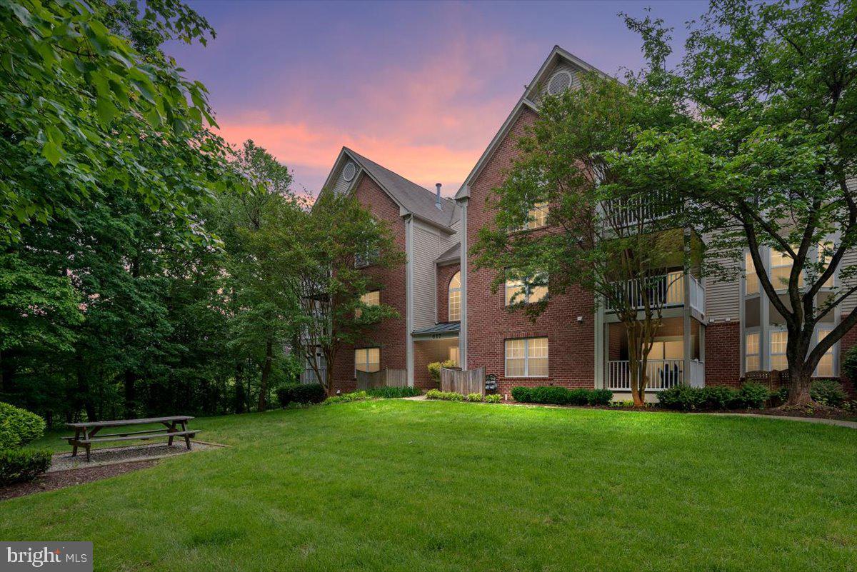 **OPEN HOUSE SUNDAY! 11am to 1pm** PRIME LOCATION!! Must see this UPGRADED ANNAPOLIS CONDO in the desired Community of Admiral Reach at Harbour Gates!  The convenience of this Location in addition to having a Main level entrance with a second-floor Balcony makes this one a PERFECT 10!! Completely UPGRADED & RENOVATED 2 Bedroom and 2 Full Bathroom Condo.  Great spot with a VERY PRIVATE Deck overlooking the peaceful trees of the Woods. Sit back, relax and watch the birds... no traffic noise here! 
Featuring NEWER top-rated Stainless Steel Appliances, Corian Countertops, Beautiful Subway Tile Backsplash, Solid Maple 42" Cabinets, New Recessed lighting & Crown Molding, Walk-in Pantry, Gleaming  Luxury Vinyl Flooring flooring throughout (water proof and scratch resistant) and so much more!! Feel right home and cozy on up to the Gas Fireplace in the Open Family Room & Kitchen area! Offering a Breakfast Bar, Table space and desk space... which is all  sure to please!  Community Amenities include- Clubhouse, Party room, Swimming pool, BBQ area, Playground, Exercise room/Gym, Basketball Courts & more! The Condo fee includes insurance, parking, common area maintenance, management and water & sewer! Quick trip to Downtown Annapolis for eating and shopping or strolling around the water's edge with an ice cream cone! Sit and watch the boats go by! Super close to the United States Naval Academy. Easy walk to the shops on Bestgate and the Annapolis Mall. Close to the Anne Arundel Medical Center and to the Annapolis Towne Centre! Commuters dream being minutes to Baltimore, and Washington DC!  Truly a great spot to live!