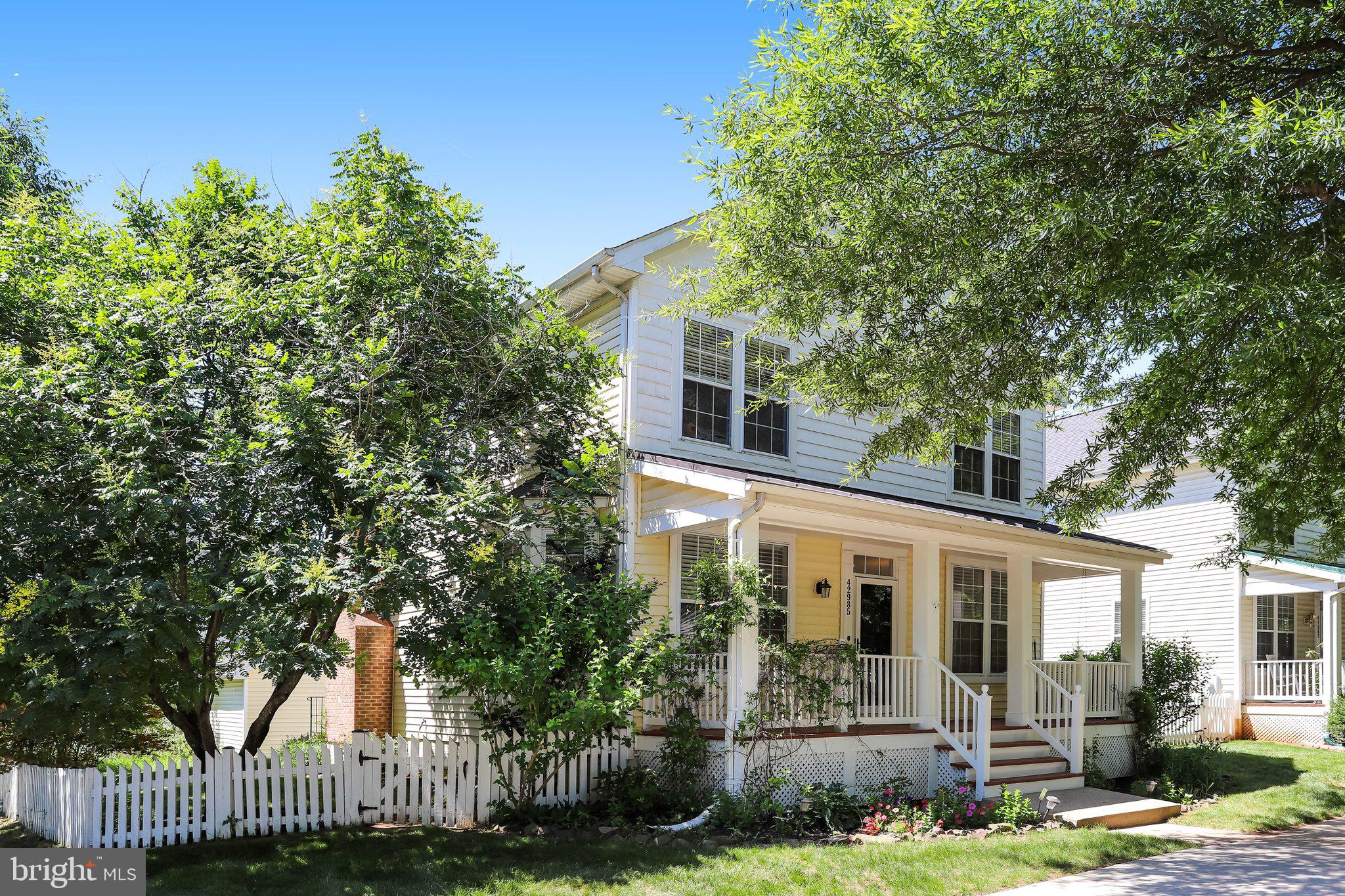 Welcome to this charming corner-lot home in the highly sought-after community of Belmont Greene! From the inviting front porch to the fully fenced rear yard, this home offers both curb appeal and comfortable living. Enjoy the convenience of a detached two-car garage, along with additional off-street parking located directly in front of the home.

Inside, you’ll find a fresh, modern feel with new paint throughout and luxury vinyl plank flooring installed on the main and upper levels. The open-concept floor plan is ideal for everyday living and entertaining, featuring a gourmet kitchen that flows seamlessly into the spacious family room. Abundant windows fill the home with natural light, creating a bright and welcoming atmosphere.

The upper level offers four bedrooms, including a primary suite, along with two full bathrooms. The main level features a formal dining room, a front sitting room/flex space, and a convenient powder room. The fully finished walk-up lower level provides additional living space with a full bathroom, making it perfect for a recreation room, guest suite, home office, or gym. A separate laundry and storage room adds valuable functionality.

Ideally situated in Belmont Greene, this move-in-ready home combines modern updates, versatile living spaces, and a fantastic location close to community amenities, shopping, dining, and commuter routes.