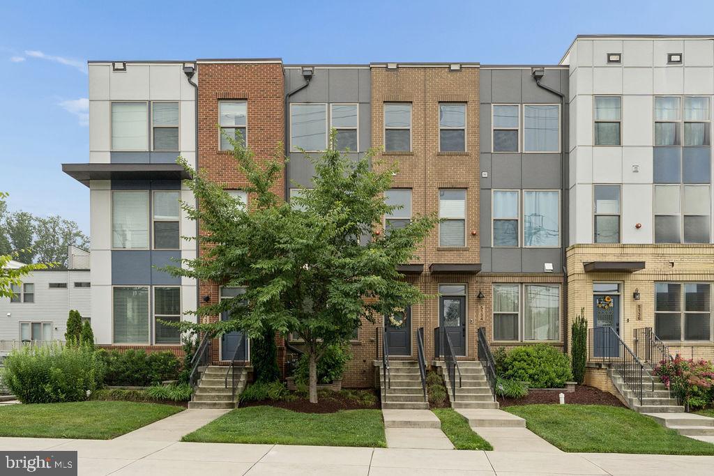Welcome to this beautiful contemporary 3-level townhome offering the perfect mix of modern style, comfort, and everyday convenience. Built in 2020, this light-filled home features 3 bedrooms, 3 full baths and 2 half baths, a versatile loft, and a private rooftop terrace perfect for relaxing or entertaining. The open-concept main level features a gourmet kitchen with a large island, stainless steel appliances, abundant cabinetry, and an easy flow into the spacious living and dining areas. Upstairs, the home offers a beautiful primary suite and generously sized secondary bedrooms. The lower level adds a flexible space ideal for a home office or fitness area. Additional highlights include a rear-entry garage, modern finishes throughout, and plenty of storage. Conveniently located just 1.2 miles from both Twinbrook and North Bethesda Metro stations, with quick access to Pike & Rose, Downtown Bethesda, Rockville Pike, shopping, dining, parks, and major commuter routes. Experience stylish, low-maintenance living in one of Rockville’s most convenient locations.
