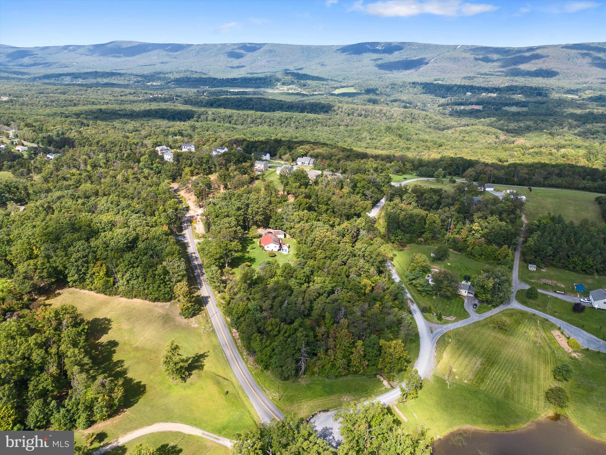 Limited opportunity to pick up a prime building site in a desirable, rural community that is thriving and growing! High View Manor features lovely, new construction with some green space between homes, and mature trees all around. Ready to build lots just minutes from town, perfect for someone who wants to be in a community, but still have some space between neighbors. Lots 36 & 37 are found on the left of Manor Dr just as it intersects with Meadow Way and are being sold collectively as one homesite totaling  3/4 of an acre. Only 8 miles to Winchester Medical Center and not on the side of a mountain, you'll love it here! Additional homesites available as well. Perfect opportunity for a builder looking to build in a growing community, or if you're looking to build bring your ideas!