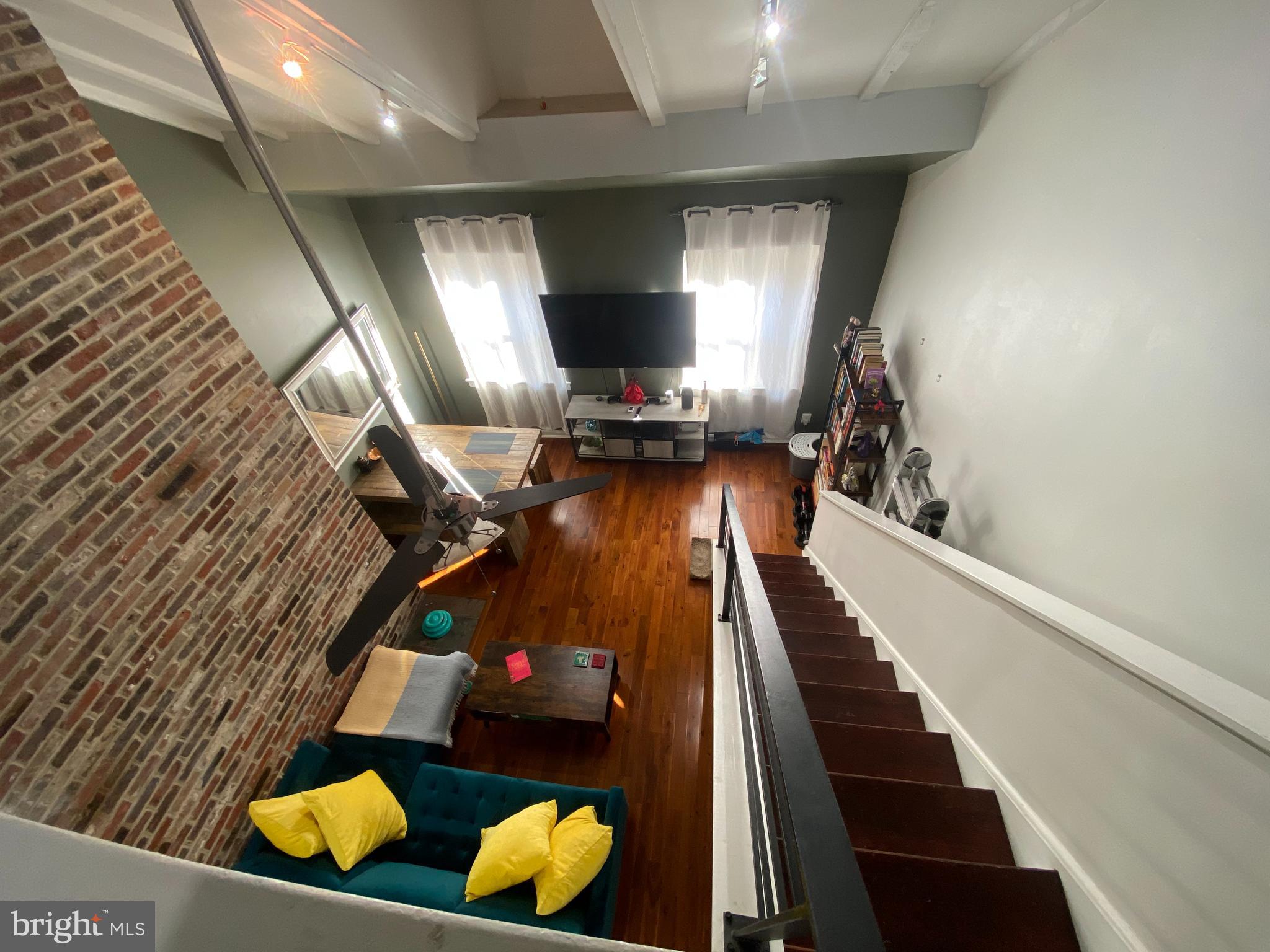 Welcome to this beautiful bi-level loft rental unit in old city!  Location Location Location! Right next to an abundance of good eats and night life this is the perfect apartment for you. The bi-level layout present features such as, high vaulted ceilings, and exposed brick accent wall, and newly finished hardwood floors though out. The kitchen presents plenty of cabinet space, a breakfast bar and beautiful white quarts counter tops perfect that is perfect for cooking at! The first floor rounds out with a smaller bedroom/ office and a full bathroom. The master bedroom upstairs overlooks the living room giving it the perfect loft feel! The master bathroom is finished with brand new custom tile work and a frameless shower, and spa bath.  Washer and drying in the unit as well!!!