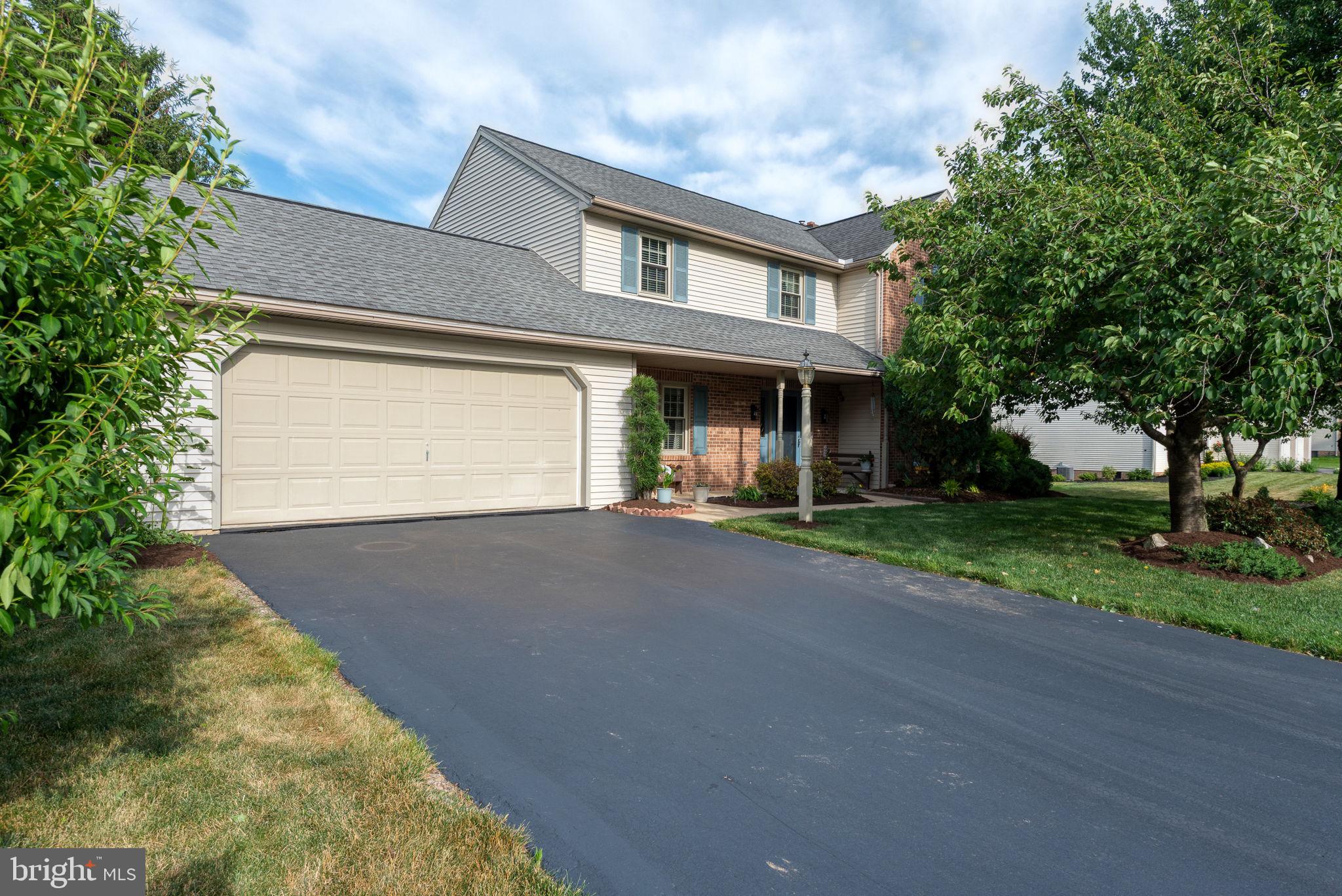 Beautifully maintained 4-bedroom, 2.5-bath home in Lititz offering over 3,000 square feet of living space. Join the coolest small town in America, with this prime Lititz location in a well-established neighborhood and Warwick schools. Hardwood floors welcome you through the foyer, formal dining room, and spacious first-floor office. The island kitchen features granite countertops, tile backsplash, a flush-mount double sink, and opens to a cozy living room with a propane gas brick fireplace. A bright four-seasons room with a cathedral ceiling provides additional living space and overlooks the private backyard. The main level also includes a convenient first-floor laundry room and powder room. Upstairs, you'll find four generously sized bedrooms and two full baths, including a spacious primary suite featuring dual closets, dual vanities, a Jacuzzi soaking tub, and a walk-in shower. The large finished walk-out basement offers additional living space, natural light from multiple windows, a spacious storage room, and direct access to the oversized one-car basement garage, ideal for a workshop, hobby space, or extra storage. Step outside to the expansive composite deck overlooking the backyard, complete with mature landscaping. Additional updates include an architectural shingle roof (2013), heat pump and central A/C (2020), water heater (2024), Brita water softener (2021), and a reverse osmosis system serving the kitchen sink.  Schedule your private showing today!