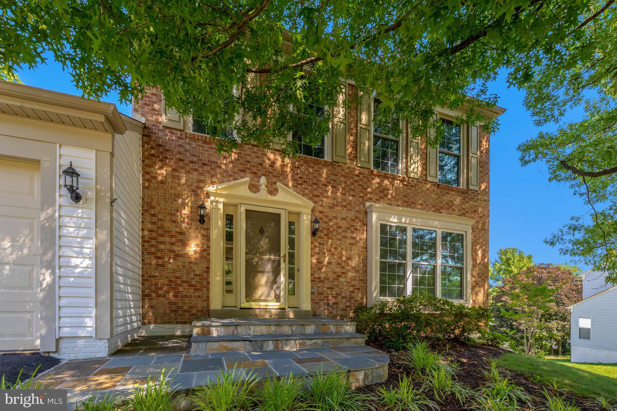 Now is your chance to live in the highly sought-after Dranesville Estates neighborhood! This home has so much to offer, starting with the full walk-out basement complete with a fourth bedroom, full bath, and wet bar area—perfect for guests, an au pair, or in-laws. The extra-large utility room gives you all the storage and hobby space you could want, and sliding glass doors lead right out to a charming brick patio.

On the main level, you'll love the sunroom addition, the perfect spot to enjoy your morning coffee. It opens to a private deck that's great for grilling, relaxing, or watching the sunset. Beautiful hardwood floors run throughout the rest of the main level, adding warmth and timeless appeal.

The updated kitchen checks all the boxes with an island that offers great storage, miles of cabinetry, stainless steel appliances, and plenty of room for a table. Best of all, it's just a few steps from the garage, making grocery trips a whole lot easier!

The spacious family room is right off the kitchen and is filled with natural light from oversized windows and the skylights!. The vaulted ceiling and cozy fireplace make it a room you'll want to spend all your time in.

Upstairs, the roomy primary suite features a vaulted ceiling, walk-in closet, and an updated en suite bath with double sinks, a glass-enclosed walk-in shower, and a private water closet. Two additional bedrooms share a full hall bath, and all of the bedrooms have brand-new carpet and fresh paint, so you can move right in and start enjoying your new home.

The location is just as wonderful as the home itself! You'll enjoy easy access to the Silver Line Metro, making commuting to Reston, Tysons, and Washington, D.C. simple. Washington Dulles International Airport is just minutes away for convenient travel, and you'll love being close to shopping, restaurants, and everyday conveniences. Historic downtown Herndon is nearby with its locally owned restaurants, coffee shops, breweries, seasonal farmers market, Friday Night Live! summer concerts and numerous community events. Outdoor enthusiasts will also appreciate quick access to the W&OD Trail for walking, running, and biking. It's the perfect combination of a friendly neighborhood, everyday convenience, and easy access to everything Northern Virginia has to offer.