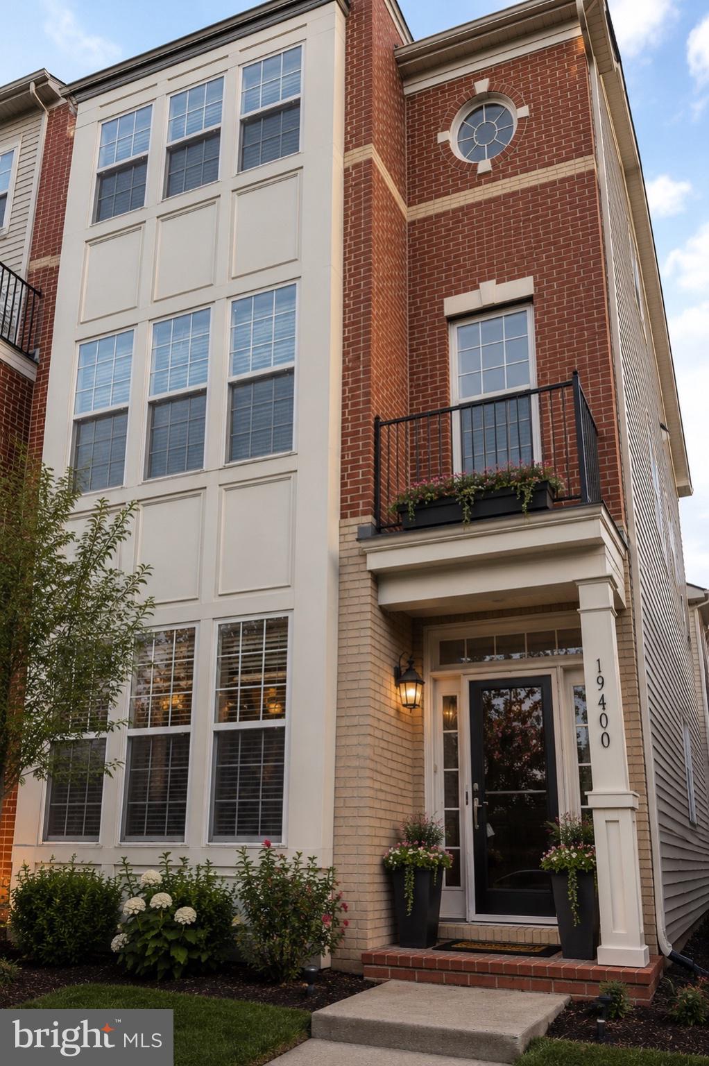 Welcome to 19400 Front Street – A Stunning End-Unit Townhome in the Heart of Lansdowne Town Center

Offering approximately 3,400 square feet of beautifully updated living space, this exceptional end-unit townhome combines luxury, comfort, and convenience. Situated on a premium lot with a spacious side yard and a two-car garage, this home has everything today’s buyers are looking for.

Step inside to discover a bright, open floor plan featuring new hardwood flooring throughout the main level. The gourmet kitchen is designed to impress with granite countertops, stainless steel appliances, a double oven, gas cooktop, rich wood cabinetry, and a large walk-in pantry. Adjacent to the kitchen, the breakfast area opens to a private outdoor patio—perfect for enjoying your morning coffee or entertaining guests.

The second-floor primary suite serves as a private retreat, complete with a spacious sitting area, luxurious soaking tub, separate walk-in shower, and generous walk-in closets. Also on this level are a convenient laundry room and a private guest suite featuring its own full bathroom and walk-in closet.

The third floor offers additional bedrooms with cathedral ceilings and abundant natural light, creating an open and airy atmosphere throughout the home.

Recent improvements provide exceptional value and peace of mind, including a new roof, new hardwood flooring, new carpeting, fresh interior paint, updated appliances, and an irrigation system.

Residents enjoy access to outstanding community amenities, including a fitness center, yoga studio, outdoor swimming pool, playgrounds, and scenic walking and jogging trails. The home is located just steps from the community pool and park and within walking distance of Lansdowne Town Center, where shopping, dining, and entertainment are right at your doorstep.

Don’t miss this opportunity to own a beautifully updated home in one of Lansdowne’s most desirable communities. Experience the perfect blend of luxury, lifestyle, and location.