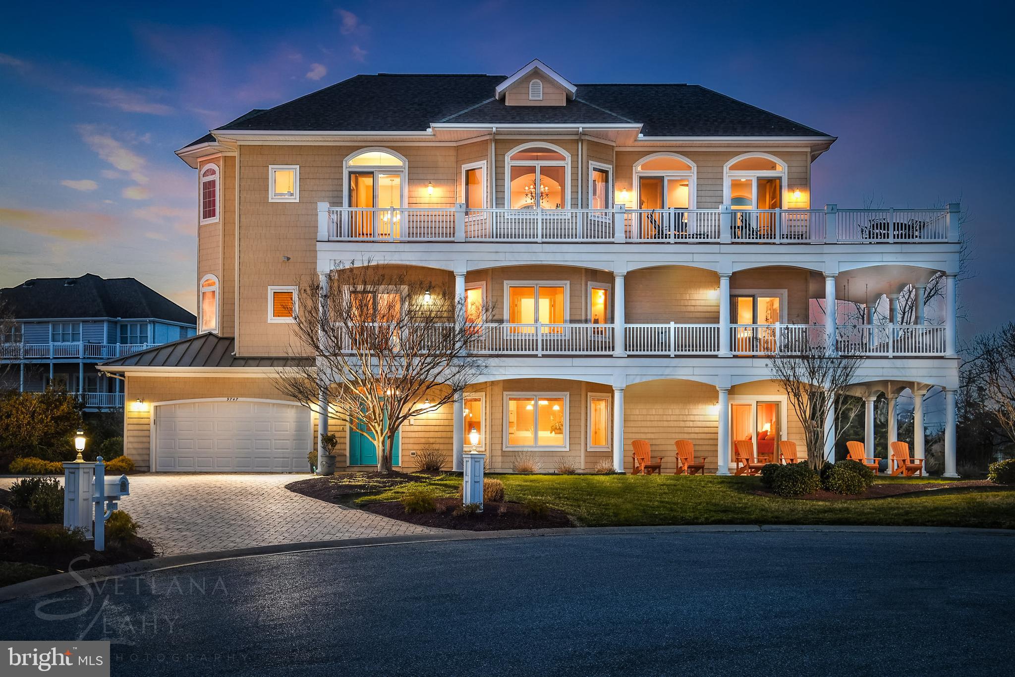 Luxurious 5BR/5 BA home in the prestigious neighborhood of  Martha's Landing in desirable West Ocean City hits the market.  This home has views of the Bay, the inlet and the Boardwalk, and has an elevator and a two car garage!  As you walk into the home you see the fabulous decor, attention to detail and exceptional craftsmanship with custom finishes throughout. This is the perfect floor plan for large families and for entertaining  guests.  On the first floor there is a large great room with wonderful kitchen and a spacious bedroom and full bath.  On the second level you will find a spacious oversize master bedroom with his and her closets, a fireplace and a glass slider leading to a beautiful wrap around deck.  There are also two addition bedrooms each with a full bath.  On the third level you will find yet another large bedroom and bath.  The professional chefs kitchen is sure to please the cook in your family.  There is plenty of storage and a large center island complete with granite countertops. The large dining area is off the kitchen and is perfect for enjoying dinner with family and friends. The large great room extends to the deck where you will enjoy endless sunsets and views of the inlet, the Bay and the boardwalk.  The house also has a two car garage, a fire sprinkler system, wrap around decks, a paver driveway and an elevator.  This home was constructed by Piney Island Builders.  (HOA - pays for grass cutting and use of pool at Sunset) Come take a look at this incredible home today and make it yours!