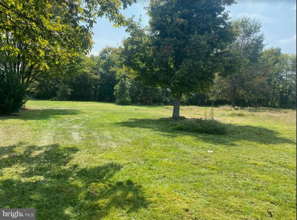 Escape to the countryside just a short drive from Hanover, where everyday conveniences meet the charm of rural living. Situated across from Hanover Shoe Farms, this 2.5-acre property offers a delightful blend of open meadows and the gentle presence of grazing horses.

The land is a blank canvas, perfectly flat and flanked by a serene forest at the back. There is a deer stand in the woods. The existing home, unfortunately, is beyond repair and slated for demolition. However, the groundwork has been done – the owner has cleared the old garage and  removed all the other junk that was on the land, saving you the hassle.
The foundation MIGHT be salvageable, this means significant savings, around $50,000, on foundation costs for your new home, if a structural engineer can certify the condition. Property has just been SURVEYED,  has just completed a successful PERC AND PROBE for a new septic system.  It  is ready to build!  Septic engineering plans for a 3 bdrm home have been done and paid for as well.   There is a new survey recently completed and stakes are clearly visible. 
Here's your chance to create your dream home in a peaceful setting, with nature as your neighbor and modern amenities just a short drive away. Don't miss out on this opportunity to build your own slice of paradise amidst the tranquility of the countryside.   We have been told- but please verify for your buyer that MOBILE HOME would be permitted, it is zoned LC - Land Conservation in Mount Pleasant Twp.