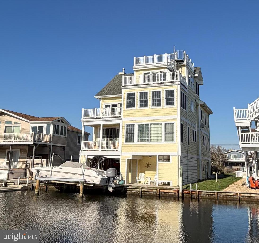 Discover coastal living at its finest.

Elegant Bay View Park Beach House

Nestled in the highly desirable private Bay View Park community, a non-incorporated area of Bethany Beach, DE, this elegant beach house features six bedrooms and seven bathrooms—comprised of four full baths and three half baths. The residence offers stunning waterfront living and beautiful scenic views, creating an exceptional coastal retreat.

Direct Canal Access and Outdoor Recreation

This home features direct canal access with a boat lift, making it an excellent spot for boating, kayaking, crabbing, and fishing. Enjoy the best of waterfront activities right from your own backyard.

Modern Kitchen and Flooring

The home features a modern kitchen equipped with granite countertops, providing both style and durability for meal preparation and entertaining. Throughout the residence, hardwood and tile flooring have been thoughtfully installed, offering a seamless blend of elegance and functionality in every room.

Distinctive Interior Features

Several bedrooms in this home showcase elegant tray ceilings, adding architectural interest and a sense of spaciousness. The main living area is designed with an open ceiling, which further contributes to the home's light-filled, airy ambiance and creates a welcoming environment for relaxation and entertaining.

Expansive Living and Dining Spaces

The second living area in the home is perfectly positioned to showcase extraordinary views of the bay, offering a tranquil setting for relaxation and gathering. Residents will enjoy the flexibility of two spacious living areas, complemented by two distinct dining spaces that are ideal for entertaining family and friends.

Outdoor Decks and Accessibility

Four decks, including a remarkable rooftop deck that provides sweeping 360-degree panoramic views—offer generous opportunities for outdoor enjoyment. Whether taking in

the sunrise with morning coffee or sunset, these spaces invite you to experience coastal living from multiple vantage points. An elevator ensures convenient access to all four floors, making every area of the home easily reachable for all residents and guests.

Bay View Park is situated amidst the preserved, untouched wetlands of the Assawoman Wildlife Area. This spot offers serene views and a peaceful ambiance just south of Bethany Beach along Coastal Highway Route 1. Across the highway, you will find a small path leading to the state beach, which tends to be less crowded than those closer to town. You can bike or drive into Bethany Beach to enjoy the town and its boardwalk.

Ideal for Living, Investment, or Rental

This beach home offers exceptional versatility, making it a wonderful choice for those seeking a primary residence, a vacation rental, or a smart investment. The property combines comfort, convenience, and scenic beauty, ensuring an appealing and practical living environment. Whether you are considering moving in, renting to guests, or investing for the future, a visit to this home will reveal its unique amenities and features, allowing you to fully appreciate everything it has to offer.