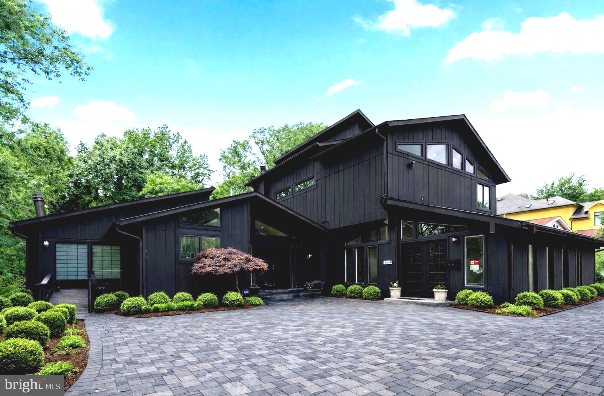 Perfect 2-family residence...Unique GLASS house with floor to ceiling glass, soaring ceilings, clerestory windows, oversized skylights and open floorplan. Perfect 2-family residence... House plus lifelong approved MCounty professional home office Expanded and renovated Thermador/Cherry gourmet kitchen with 10ft granite island.  Minimalist open steel staircase bracing floating oak treads and glass railings surround by floor to ceiling slate and bamboo finishes.   SPA BATHS.  Main level bedroom potential with two closets and tumbled marble & travertine  full bath.  Upstairs ensuite bedroom in the "clouds" offering floor to ceiling windows overlooking rear yard, wide plank hardwoods and sexy bath with floor to ceiling white marble, oversized shower w/frameless shower door, extended wall mounted vanity with vessel sinks, soaking tub and large walk in closet.  Completely finished bright WALKOUT lower level with high ceilings, bedrooms, bath and FULL granite kitchen.  Double decks extended from house not to discourage natural light to lower level.  Beautiful and private half plus acre lot.  Professional main level office with separate entrance, vaulted ceilings, skylights, bath can be converted to separate ensuite bedroom/car storage.  NEWER THREE zone HVAC! Conveniently located with short walk to library and Potomac Village complete with markets/restaurants/bakery/banks/Starbucks.