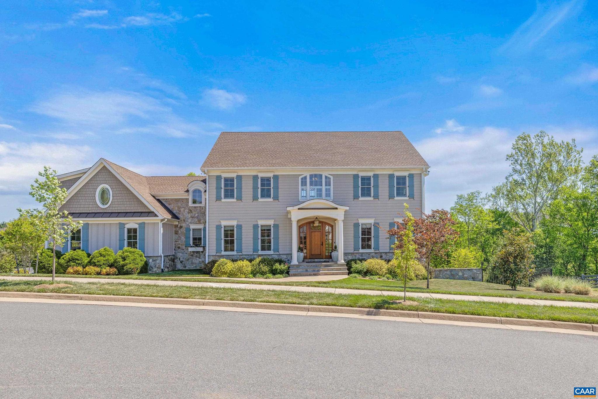 Immaculate Custom Home in the Creekside section of Old Trail?set on almost half an acre with mountain views from the front AND peaceful pond and garden views from the screened back porch. Over 4,400 sq ft of like-new finished living space plus nearly 2,000 sq ft of unfinished walk-out basement?an ideal blank canvas for a gym, media room, or future expansion! This 5-bedroom, 5.5-bath residence is appointed with elegant finishes throughout: coffered ceilings in the great room, built-in cabinetry, intricate crown moulding and decorative wall panels. The light-filled kitchen features stainless appliances, a large pantry with abundant storage and an extra refrigerator. A main-level dedicated home office adds convenience for remote work. Two bedrooms offer private ensuite baths; the primary suite includes a sitting area, mountain views, and a luxurious bath with a claw-foot tub and spacious walk-in shower. Thoughtful indoor-outdoor living amenities include a pass-through gas fireplace between the great room and the Trex grilling/sitting deck, a screened porch overlooking the garden and pond, newly landscaped stairs, and a fenced backyard for privacy and play. A rare blend of refined detail and practical space!,Granite Counter,White Cabinets,Fireplace in Family Room