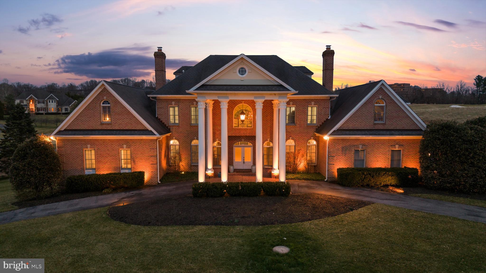 ** Newly Adjusted Offering Price ** Welcome to 505 Pond View Lane, a stately Georgian manor overlooking the fairways of Hayfields Country Club. Located in the prestigious Hayfields Manor community of Hunt Valley, this exceptional residence offers over 12,000 square feet of grand living and entertaining space across four expansive levels. Now presented with six updated bathrooms and a freshly painted interior throughout, the residence combines timeless architecture with thoughtfully refreshed interiors and renewed presentation. Perfectly positioned along the golf course, the home enjoys sweeping views of lush fairways and a tranquil pond, creating a peaceful backdrop to the main living spaces. A stately columned façade and circular drive introduce the residence, leading into a two story foyer with marble flooring and a sweeping curved staircase that anchors the floorplan. From this central entry, the layout reveals views into the formal living and dining rooms while offering a glimpse into the main living room beyond. Hardwood floors extend throughout the main level, where thoughtfully designed spaces balance elegance with functionality. The residence offers a natural flow between living spaces, creating an inviting layout for both entertaining and everyday living. The double height living room is filled with natural light from expansive windows that frame beautiful views of the fairway, while a striking double sided fireplace creates a warm focal point. A second level balcony overlooks the living room below. Elegant spaces include a formal living room and dining room, each with its own fireplace. At the heart of the home, the gourmet kitchen features a commercial range with hood, double ovens, stainless steel appliances, granite countertops, custom cabinetry, a large center island with prep sink and breakfast bar seating, and a walk in pantry. A wine and coffee bar add convenience, while the spacious dining area provides the perfect setting for everyday meals or larger gatherings. Both the living room and kitchen dining area open to the expansive rear deck and patio, creating seamless indoor outdoor flow for entertaining while enjoying scenic golf course views. The main level primary suite offers a peaceful retreat with a cozy sitting area with fireplace, two large walk-in closets, and private deck access. The spa style bath features updated dual vanities, soaking tub, walk in shower, and a separate water closet. A private study with its own fireplace is located just off the primary suite. The main level also includes a powder room, laundry room, secondary staircase, and an additional full bath with updated flooring and vanity, along with access to the oversized three car garage. The second level offers four generously sized bedrooms, each with an attached bath featuring updated vanities and flooring. Three bedrooms include walk in closets, while the fourth offers ample closet space. A spacious game room completes the level. The third level features another large bedroom suite with its own full bath, closet area, and sitting or media space. The finished lower level adds over 3,700 square feet of living space, including a full kitchen with quartz countertops, recreation areas, gym space, bedroom, and full bath. This level also provides direct access to the covered patio and backyard. Members of Hayfields Country Club enjoy access to championship golf, dining at the Redwood Grille and Hayfields Mansion, swimming, pickleball, bocce courts, and a vibrant social calendar. Conveniently located just minutes from Interstate 83, Hunt Valley Towne Centre, Shawan Downs Equestrian Center & Steeplechase course, and Oregon Ridge Park. Welcome to Hayfields Manor and the lifestyle that comes with living in one of Hunt Valley’s most sought after communities.