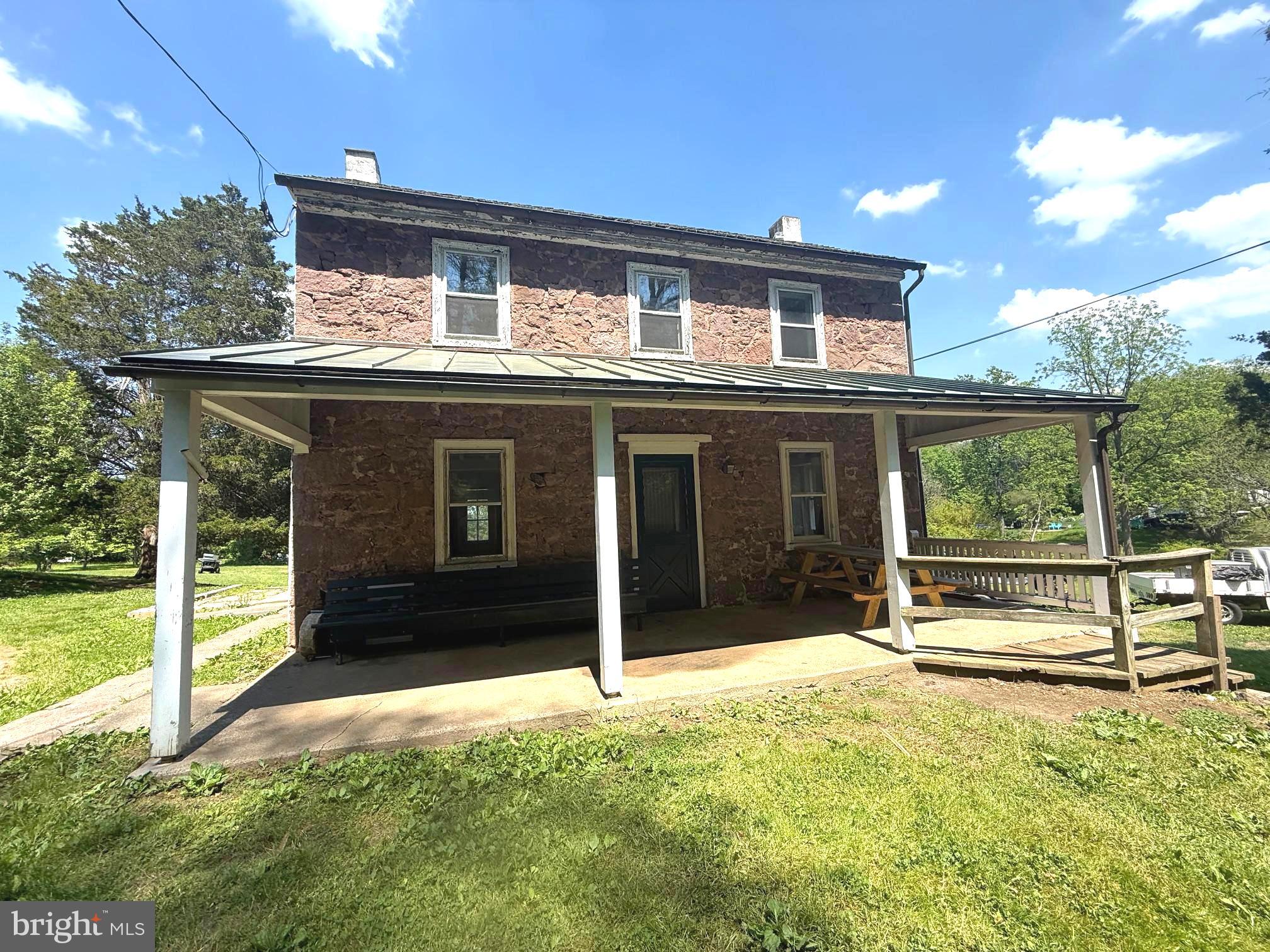 Set on approximately 5 picturesque acres in desirable Chester County, this charming 1800s Brownstone farmhouse offers endless potential,  including possible subdivision opportunities. Located within the highly sought-after Owen J. Roberts School District, this 3-bedroom home is rich with character and ready for your vision to bring it to life.
Positioned at the corner of Catfish Lane and Temple Road, the property enjoys scenic views overlooking the large pond across the street, creating a peaceful country setting with convenient access to modern utilities. Public sewer is available at both Catfish Lane and Temple Road, adding to the property's future possibilities.
Inside, you’ll find timeless features including hardwood floors, deep window wells, and a spacious covered front porch perfect for relaxing and enjoying the surrounding landscape. Recent updates appear to include a newer heating system and an upgraded electrical panel with circuit breakers.
Whether you're looking to restore a historic farmhouse, create your forever home, or explore investment and subdivision potential, this unique property presents a rare opportunity in a prime Chester County location.
Room dimensions and sizes are approximate and should be independently verified by the buyer.