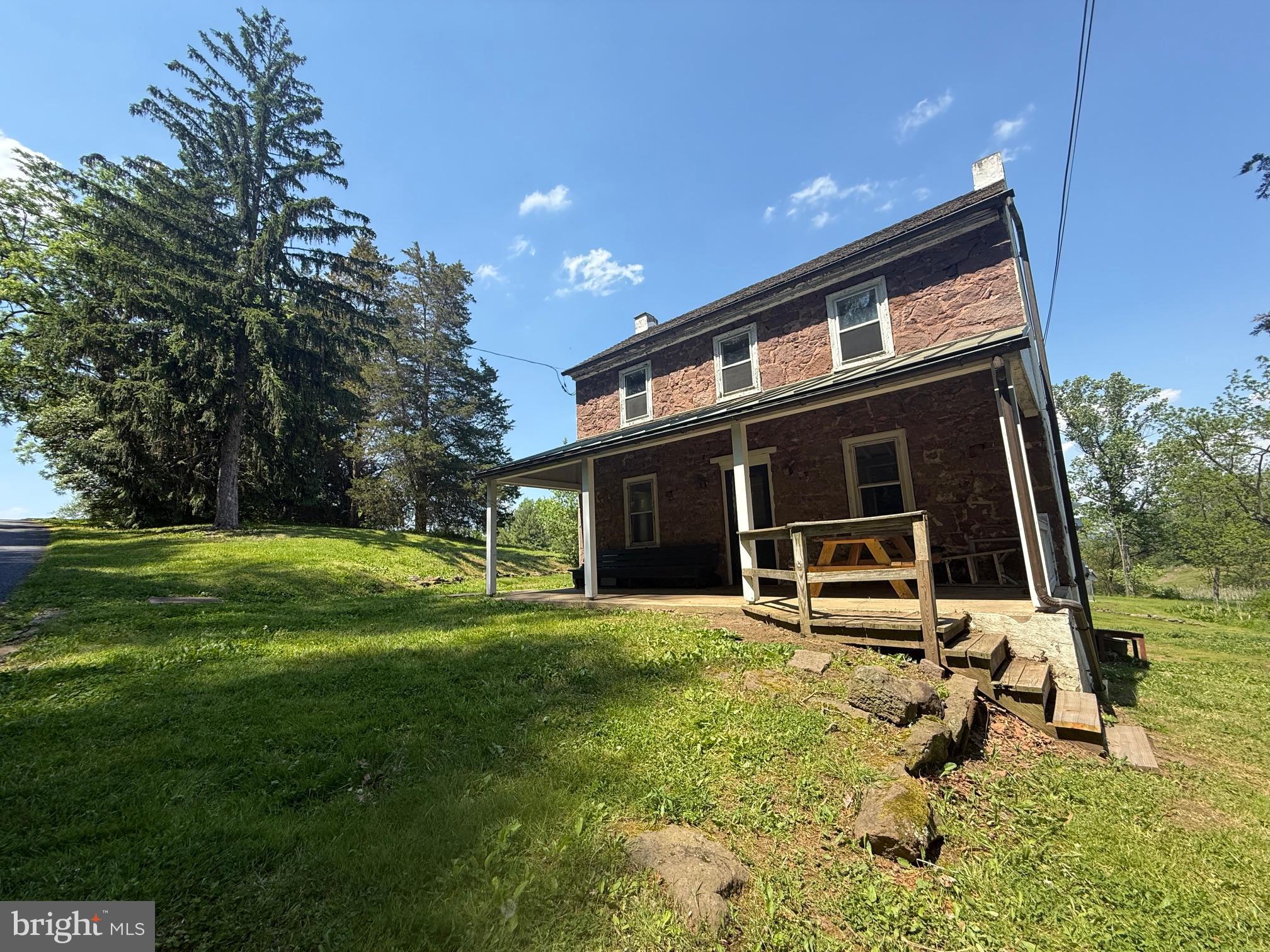 Set on approximately 5 picturesque acres in desirable Chester County, this charming 1800s Brownstone farmhouse offers endless potential,  including possible subdivision opportunities. Located within the highly sought-after Owen J. Roberts School District, this 3-bedroom home is rich with character and ready for your vision to bring it to life.
Positioned at the corner of Catfish Lane and Temple Road, the property enjoys scenic views overlooking the large pond across the street, creating a peaceful country setting with convenient access to modern utilities. Public sewer is available at both Catfish Lane and Temple Road, adding to the property's future possibilities.
Inside, you’ll find timeless features including hardwood floors, deep window wells, and a spacious covered front porch perfect for relaxing and enjoying the surrounding landscape. Recent updates appear to include a newer heating system and an upgraded electrical panel with circuit breakers.
Whether you're looking to restore a historic farmhouse, create your forever home, or explore investment and subdivision potential, this unique property presents a rare opportunity in a prime Chester County location.
Room dimensions and sizes are approximate and should be independently verified by the buyer.