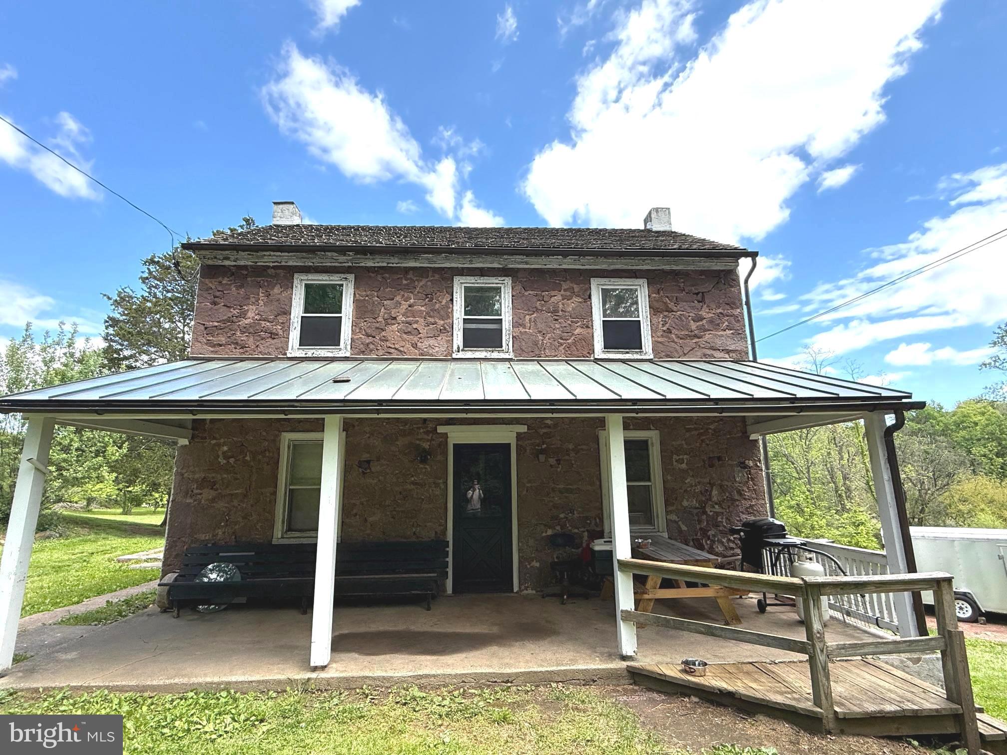 Set on approximately 5 picturesque acres in desirable Chester County, this charming 1800s Brownstone farmhouse offers endless potential,  including possible subdivision opportunities. Located within the highly sought-after Owen J. Roberts School District, this 3-bedroom home is rich with character and ready for your vision to bring it to life.
Positioned at the corner of Catfish Lane and Temple Road, the property enjoys scenic views overlooking the large pond across the street, creating a peaceful country setting with convenient access to modern utilities. Public sewer is available at both Catfish Lane and Temple Road, adding to the property's future possibilities.
Inside, you’ll find timeless features including hardwood floors, deep window wells, and a spacious covered front porch perfect for relaxing and enjoying the surrounding landscape. Recent updates appear to include a newer heating system and an upgraded electrical panel with circuit breakers.
Whether you're looking to restore a historic farmhouse, create your forever home, or explore investment and subdivision potential, this unique property presents a rare opportunity in a prime Chester County location.
Room dimensions and sizes are approximate and should be independently verified by the buyer.