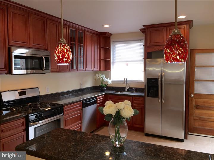Looking for a gorgeous new large kitchen? Want a house that has been renovated and ready to move in, then this is the house for you! This house will delight you when you enter to see the large straight through that has been opened to the kitchen and new pendant lighting with a granite breakfast bar.  The inlay solid wood floors have been refinished to their original condition and the wood work from past workmanship, has been protected and kept in the house to also show the original design. A large livingroom  has a  mantel that would be a perfect spot for a flat screen television. The dining room has plenty of space for a large formal dining room set and perfect for family gatherings. Then...what a kitchen! Tall solid wood cherry wood cabinets, open shelf around the window above the kitchen sink, granite countertop and plenty of it! This kitchen has 7 drawers for the most organized cook! Stainless steel appliances, refrigerator, dishwasher, stove and hood microwave makes the kitchen complete, and even enough room for a bistro table. The breakfast bar and new pendant lighting helps with additional seating.  Work your way upstairs to the three good sized bedrooms all designer paint and ceiling fans. A cedar closet in the hallway will protect your clothes for the change of seasons.  The bathroom has custom tile work, separate shower stall, new tub, granite vanity top, new designer lighting - this bathroom is sparkling new waiting for the new owners.  The basement has been freshly sealed and painted and ready to finish.  Private parking in the back, and the garage is also perfect for more storage.  Make your appointment today!