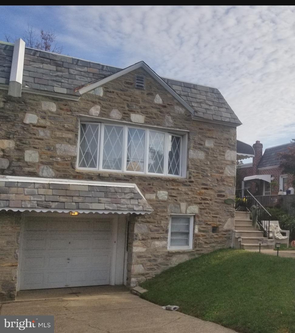 Desirable Fox Chase area, stone front twin ranch w/central air, 3 bdrm 1.1 bath, spacious living rm & dining rm, eat in kit - Refrig incl, hallway leading to 3 bdrms, c/t hall bath, coat closet and linen closet. Lower level: HUGE finished basement with powder rm, large storage closet, exit to rear fenced in yard.  HUGE laundry room (washer and dryer incl), with exit door to front  garage  (elec dr opener) and driveway.  Very nice block, convenient to transportation -bus and train, walking distance to Rhawn and Verree for all necessities - gas, food, pharmacy, etc.  Owner is sad to go... after 30 yrs!