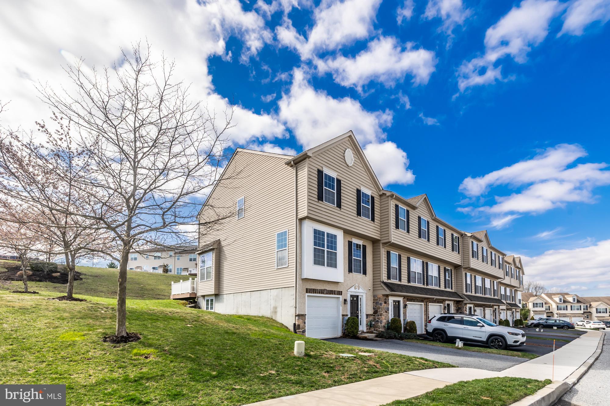 Discover this beautifully updated end-unit townhome, one of the largest in the Southview community! With fresh paint and new carpet throughout, this home is move-in ready and offers a fantastic layout with versatile living spaces.

Enter through the front door or the attached garage into the lower level, where you’ll find a convenient powder room, laundry area, and a spacious bonus room—perfect for a home office, gym, or playroom.

The main level boasts 9+ foot ceilings and abundant natural light, creating an airy and inviting atmosphere. The rear of this level features elegant hardwood flooring and a well-appointed kitchen with granite countertops, a center island with seating, and gas cooking. An eat-in dining area complements the space, and the additional bump-out provides extra room for a cozy sitting area or additional workspace, as well as access to the rear deck.

Upstairs, the primary suite is a true retreat, complete with a walk-in closet and an expansive en-suite bathroom featuring a double vanity, a luxurious soaking tub, and a separate shower. Two additional bedrooms share a well-sized hall bathroom, offering plenty of space for family or guests.

Don’t miss your chance to own this stunning, oversized townhome in Southview—schedule your showing today!