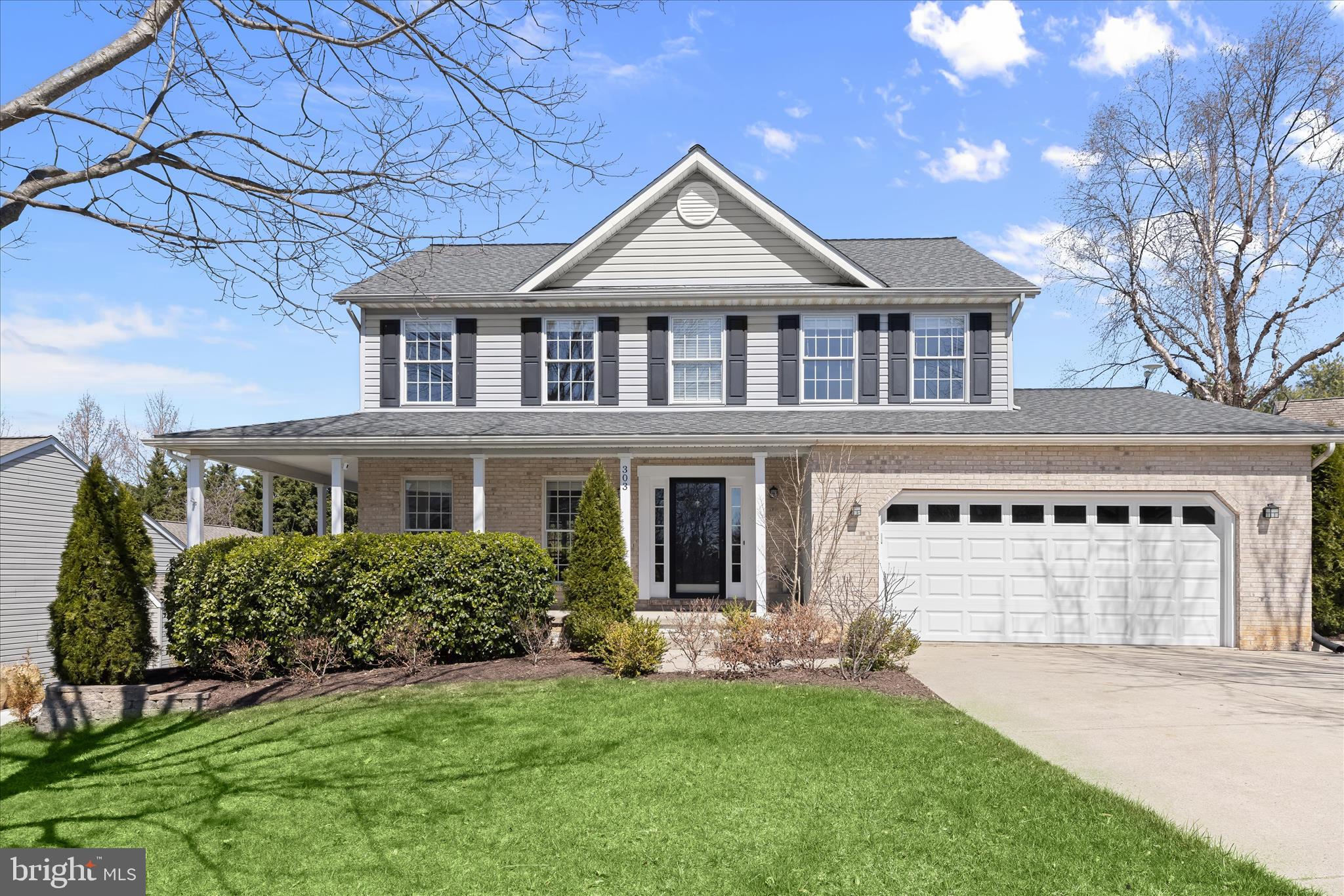 Welcome to 303 Bridlewreath Way, a beautiful Colonial with modern farmhouse charm nestled in the desirable Summit Ridge community of Mt. Airy. Oversized windows bathe the home in natural light, while luxury vinyl plank flooring, plush carpeting, and classic moldings create a warm and inviting atmosphere throughout. A welcoming foyer opens to the formal living and dining rooms, where the dining room is highlighted by a charming bay window that enhances the space perfect for gatherings both casual and formal. At the heart of the home, the spacious eat-in kitchen blends timeless style with farmhouse-inspired touches, featuring sleek stainless steel appliances, granite countertops, a classic subway tile backsplash, and open shelving that adds both character and function. The adjoining family room offers a cozy setting anchored by a fireplace, creating the perfect place to relax and unwind. Just beyond, the bright morning room provides an additional gathering space with a pass-through window to the kitchen and direct access to the custom patio and fully fenced backyard ideal for effortless indoor-outdoor living and entertaining.
Upstairs, the expansive primary suite offers a peaceful retreat with soaring cathedral ceilings and a private en-suite bath featuring a soaking tub and glass-enclosed shower. Three additional generously sized bedrooms and a beautifully renovated full bath complete the upper level.
The finished lower level expands the home’s versatility with a spacious recreation room featuring walk-up access to the backyard, along with a bonus room, full bath, and laundry area perfect for guests, hobbies, or additional living space. Outdoor living is just as inviting, with a covered wraparound front porch that captures the home’s farmhouse charm, a spacious patio ideal for entertaining, and a fully fenced backyard complete with secure storage. Notable updates provide peace of mind and modern convenience, including a radon mitigation system installed in 2024; new patio, exterior lighting, water heater, and storm door in 2023; front porch posts replaced in 2022; a 2020 kitchen renovation with new cabinetry, granite countertops, stainless steel appliances, luxury vinyl plank flooring on the main level, and a new washer and dryer; fence installation in 2020; and a new HVAC system installed in 2019. This thoughtfully updated home offers comfort, style, and farmhouse-inspired warmth in a wonderful community setting.