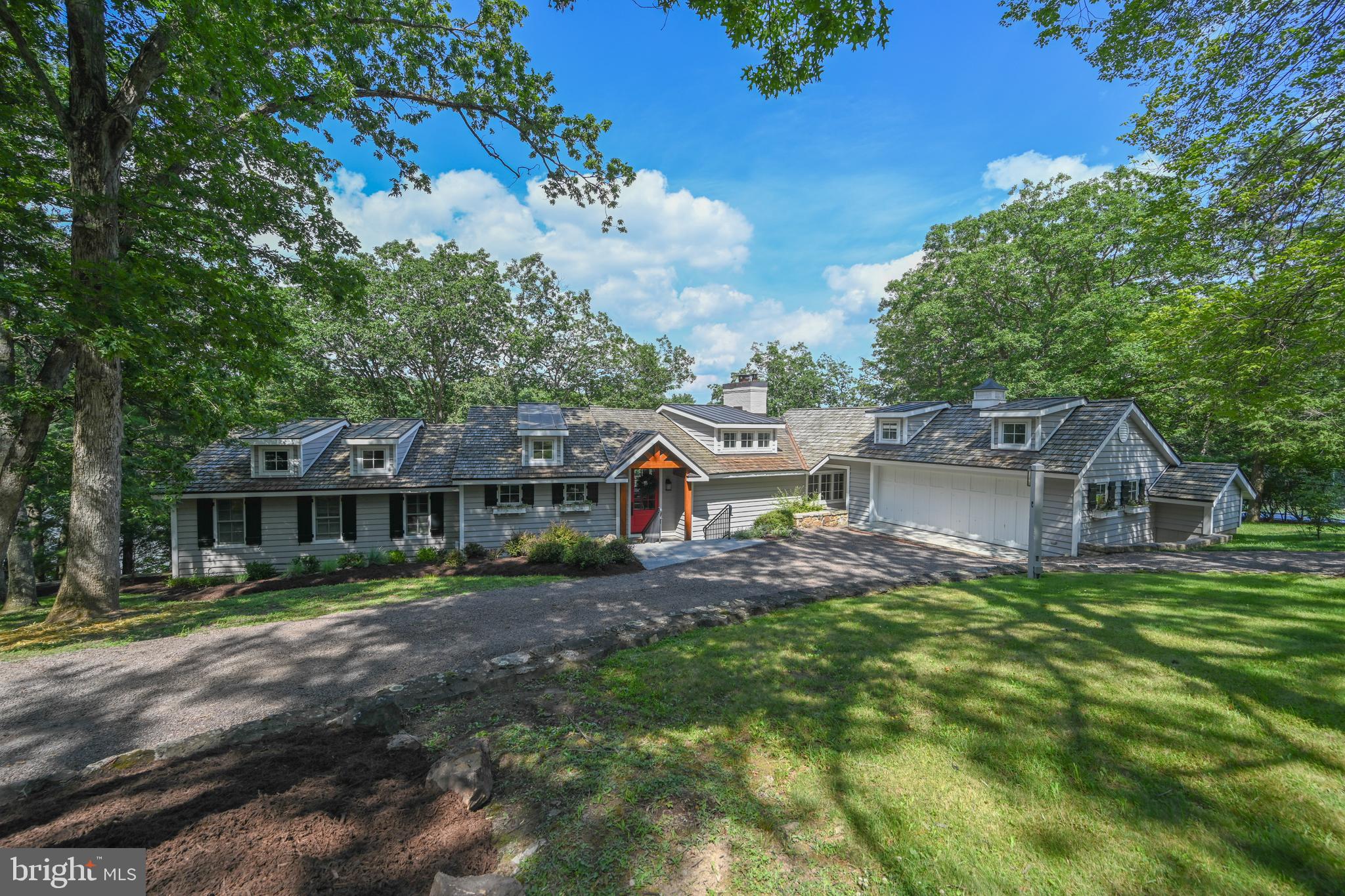 A one of a kind lakefront retreat overlooking a beautiful cove in the peaceful Pergin Farm community at Deep Creek Lake.   Situated at the end of a quiet lane, the completely updated 5 bedroom 4.5 bath cottage style home with 200' of prime frontage at the end of private lane.   

The impressive cottage style residence offers an inviting open main level living area with a fabulous kitchen, beautiful wood burning fireplace, 3 suites and direct access to an expansive deck with a hot tub that has been built into the deck surface.   The lower level offers two additional suites and a relaxing lakeside family room.   

Enjoy the fire pit area overlooking the beautiful cove or take a walk on over 3 miles of private roads throughout the community.  

A complete listing of all the property upgrades is available in the property document section.  

The adjoining property with guest cottage and tennis court may be purchased as a package with the subject or sold separately.  

The subject property was considered one of the best spots in Pergin Farm when it was developed by Perry and Virginia Smith approximately 50 years ago.  Perry and his wife carefully developed Pergin Farm with a commitment to limiting development and protecting the natural beauty the area offered.   The majority of the homesites created are larger than most of the lots created in other sections of the lake.  Perry's daughter Randee and her husband Mark have continued protecting Pergin Farm from over development with their responsible stewardship of the remaining lands that they continue to hold.  

Not long ago, the Pergin Farm homeowners modified the subdivision to end short term vacation rentals adding to the attraction of the community.  More recently high speed internet was brought to the community.     The roads within the subdivision have remained private and offer the ideal environment for walking biking or even hiking.