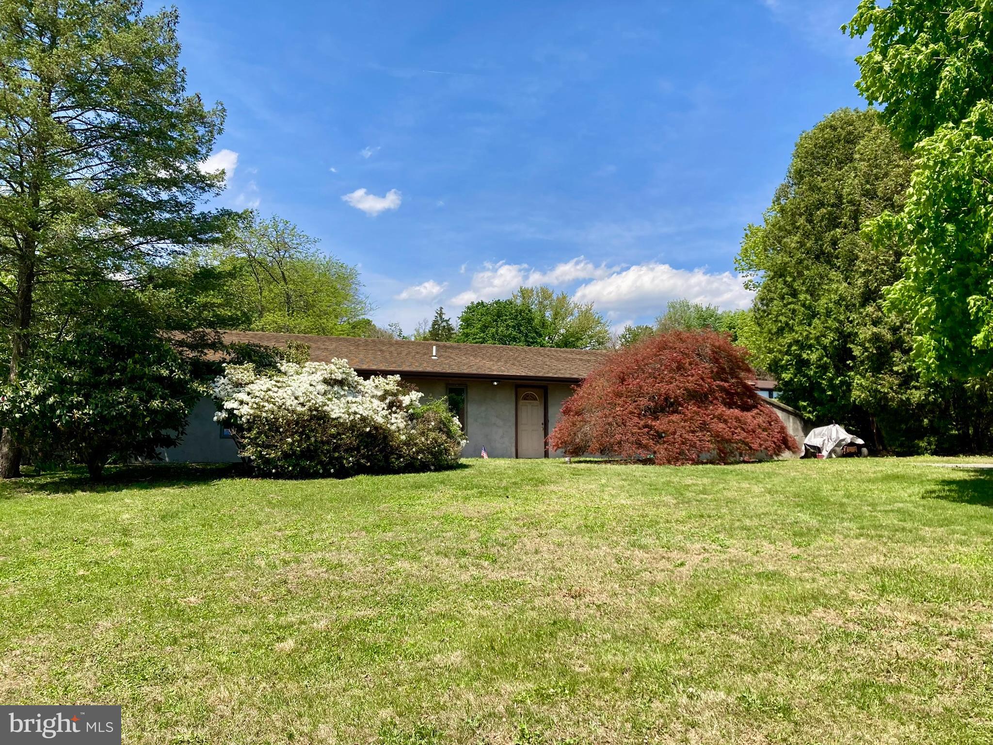 We did not meet the reserve at the auction and are open to offers! Unique opportunity to own an earth home in the Hamburg Area School District! This 3-bedroom, 2 full bath property offers a functional layout featuring a comfortable living room, formal dining room, and an eat-in kitchen. The home is equipped with electric baseboard heat and electric hot water and is serviced by well water and public sewer. Step outside to enjoy a colorful landscape with mature trees and bushes, creating a peaceful and private setting. The cement patio space is perfect for relaxing or entertaining. Located in a quiet neighborhood with no through traffic, this property offers added privacy and minimal noise. This home provides a distinctive living experience and is ready for your personal touch—an excellent option for buyers seeking something a little different or a solid investment opportunity.