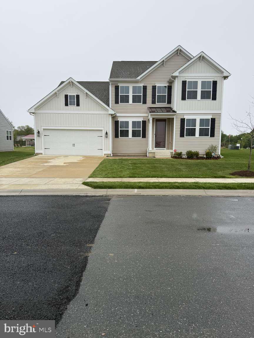 Welcome to this home, a gem in the 55+ community in Hatteras Hills, Magnolia, DE. Built in 2023 at the corner, this two-story house boasts over 2700 square feet of living space, including 4 bedrooms, 3.5 bathrooms, and a 2-car garage. With its bright and fresh appearance—both inside and out—the house looks just like a brand-new home. Upon entering, you'll find a home office with a modern slide door, a charming and well-proportioned space with windows that let in plenty of morning sunlight, providing an invigorating start to the workday. Opposite it is an extra bedroom for guests (or a living room) with a full bathroom, carpeted for comfort. Further on, a small hallway leads to an open-concept layout with a large modern great room with a high ceiling and a built-in fireplace for added warmth in the winter. The beautiful modern kitchen looks brand new with a high-quality range hood, a large island and roomy pantry, making it ideal for both everyday living and entertaining. Just off that part is the luxurious primary suite, which offers a private retreat with its own bath and walk-in closet. The second floor has 2 more bedrooms and a full bathroom, and the loft provides additional space for relaxing, entertaining, or enjoying hobbies. The included bright full basement with a walk-out slide door makes the house more flexible for living and activities. Outside the house is a patio at the front, which offers a spot for sunbathing in the morning and enjoying the breeze in the afternoon. A small garden allows you to plant flowers, while a spacious, lush green lawn—complete with an irrigation system and street lighting for the evening—enhances the beauty of the home. The home is situated near Route 1—approximately a 40-minute drive to Rehoboth Beach and the Lewes Ferry Terminal. Additionally, it is just a 10-minute drive to the bustling shopping district of Dover and the hospital. A mere five-minute drive brings you to Dover’s bustling commercial district, home to a wide array of restaurants and shops. Additionally, a scenic 35-to-40-minute drive takes you to the Lewes–Cape May Ferry terminal, or to the beautiful shores of Rehoboth Beach and Bethany Beach. Another standout feature is that this home is situated within a newly built 55+ community, boasting a spacious swimming pool, a pickleball court, and a clubhouse complete with a gym, ballroom, game room, and library. Numerous resident-led groups have been established to foster a vibrant social atmosphere and provide opportunities for learning and leisure—including clubs for yoga, gardening, sports enthusiasts, cycling, and more. In short, you certainly won't regret becoming a resident of this active and engaging community.