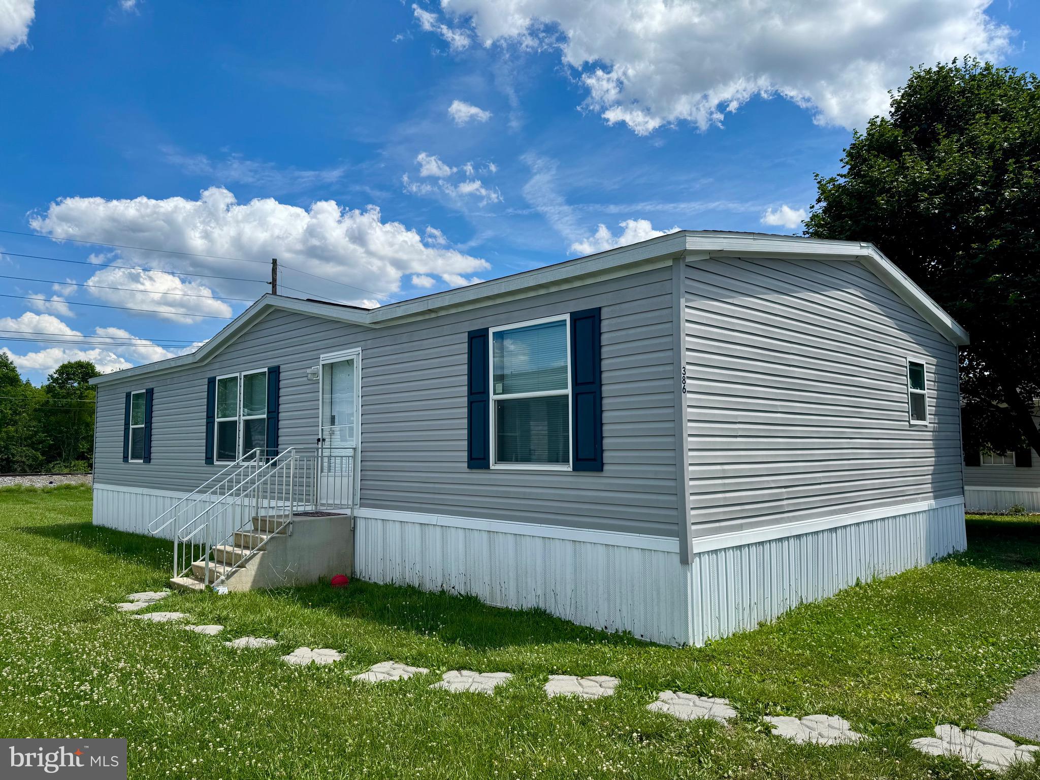 Welcome to Royal Crest Estates! This well-maintained 2023 Skyline/Prime manufactured home offers approximately 1,493 square feet of comfortable living space with 3 bedrooms, 2 full baths, and an inviting open-concept floor plan. The spacious kitchen features a center island, abundant cabinetry, and flows seamlessly into the main living area, making it ideal for everyday living and entertaining. A separate laundry room adds convenience, while the generous primary suite includes a large private bath and additional closet space. Outside, you'll find parking for up to four vehicles and a storage shed for extra storage needs. Residents enjoy access to the community tot lot, along with trash and snow removal included in the monthly lot rent of $555. Buyer must be approved by Royal Crest Estates prior to settlement. Application fee is $36 per adult applicant. Pets up to 25 lbs are permitted. Please contact Tammy Snow at Royal Crest Estates regarding community approval requirements and submit the approved application with all offers.