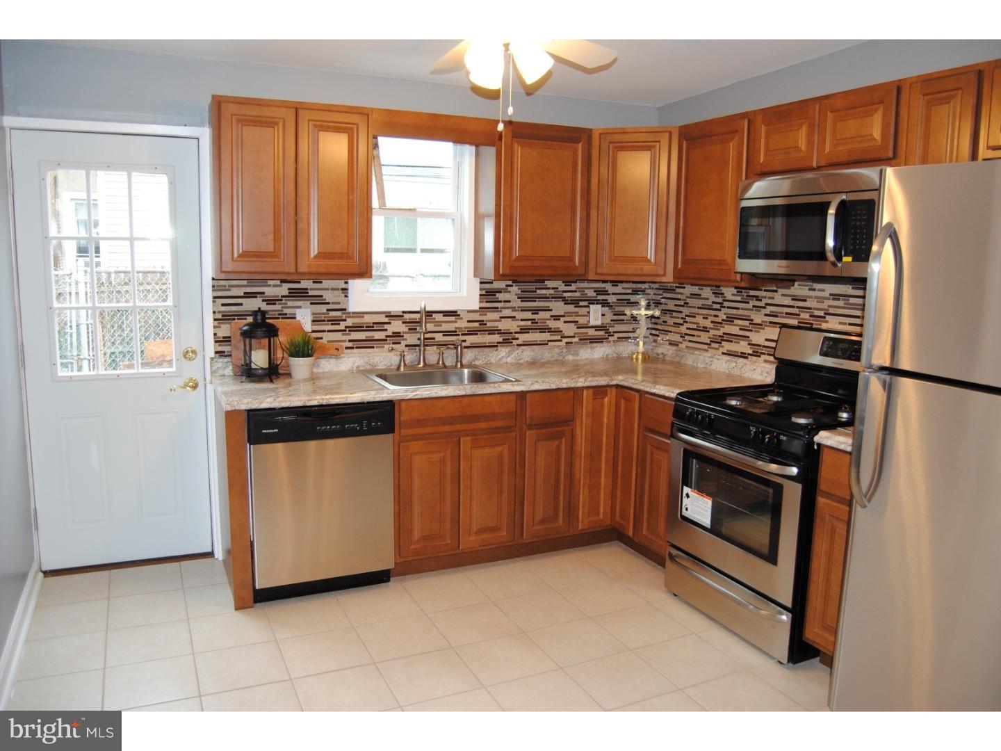 JUST REDUCED !!Great oppurtunity to buy in prime red hot Port Richmond ! Formal living room with tiled mud area and hardwood flooring, ceiling fan. Modern open  straight through floor plan with a large formal dining area with ceiling fan and hardwood flooring . Large eat in kitchen , new kitchen including cabinets , s/s gas range , refrigerator , dishwasher and built in microwave , ceramic tiled floor , tiled back splash , and stainless steel sink . Exit to rear fenced cement yard . Newer siding in rear . 2nd floor has rear bedroom with new carpets , middle bedroom with new carpets , master bedroom with ceiling fan and new carpets . New center hall bath with tiled floor and shower wall. New sink , toilet , vanity ! Full clean builders basement . Come and make this home yours ! Close to majors roads , public transportation, shopping , center city , and NJ . Need a quick settlement ? no problem .