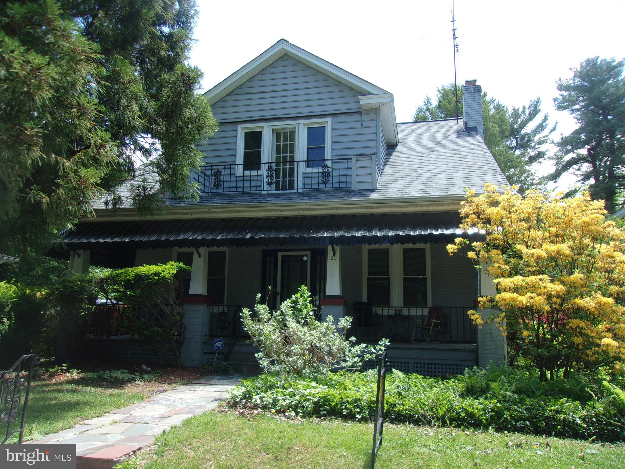 Welcome to 25 Maryland Ave.!  At the side is off-street parking with driveway and carport providing easy front or back access into the house.  Follow the flagstone walkway up to the charming, large covered porch of this 1923 Cape Cod/Bungalow on  .21 acres.  Step into the Living Room, featuring the original fireplace . There is an arched entrance into the Library/Music Room  and another into the spacious dining room with chandelier. The first floor boasts newly refinished original red oak floors.  Continue into the efficient kitchen with oak mission style, soft close cabinets. The refrigerator is in an alcove which could be reconfigured to provide  a larger pantry space.  A small peninsula has seating for 2 and opens up into the Family Room.  The Family Room is a relaxed space with brick accent wall and an attached full bath.      Upstairs are 3 newly painted bedrooms and full Bath with a  new shower. The bedrooms are not large, but all have walk-in closets ( the primary bedroom has 2! ).     The lowest level of the house has a huge Recreation Room.  So many possibilities.... ping pong or pool table, TV/Media area,  game room and more - or any combination.  Lots of space for entertaining.  There is also a laundry area, utility space and room for a possible workshop.  Convenient bath with toilet and shower.  The back of the house has a screened in porch - so nice to enjoy any time of the day.  Exit into the back yard....What a wonderful space and so private!  Flagstone area for seating or outdoor grilling.  Lovely expansive lawn, even room for a garden at the back of the property.   Or stroll through a contemporary cottage garden bower with delightful landscaping.  These outdoor areas invite you to welcome the day or take a moment to relax and enjoy the evening.