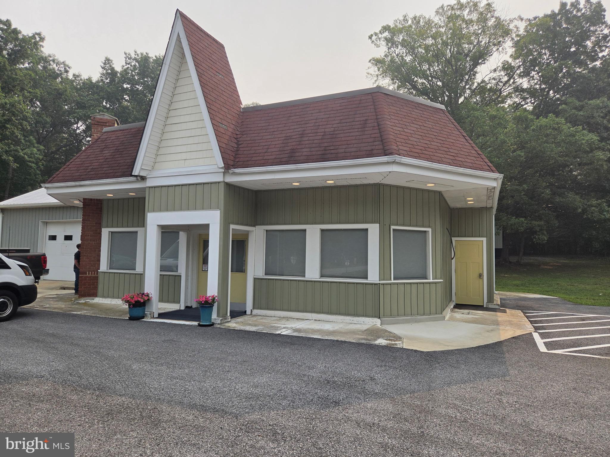 4.5 ACRES WITH ROUTE 301 FRONTAGE. Exceptional commercial opportunity situated on 4.5 level acres zoned Community Commercial (CC) with Route 301 frontage and outstanding pylon signage. 

Featuring a freshly updated 2,724 sq ft main structure, this property includes a welcoming reception/showroom area, several private offices, a large meeting room, and two updated restrooms. Interior improvements feature new HVAC, new flooring, fresh paint, new ceilings, and modern lighting throughout.

Unmatched functionality for equipment, storage, or operational needs: includes a new 28'x43' storage building with a massive 16'x12' bay door, an attached 2-bay garage/storage building with a restroom, a separate 12'x20' detached garage with electric and HVAC, plus an additional outside restroom. Features direct access from Rt 301 plus additional access via Fair Grounds Road at the rear. Positioned along a high-visibility corridor with strong daily traffic counts (2024 AADT: 20,851 / 21,271 weekday average), just minutes from Waldorf, La Plata, Dahlgren, VA, and major regional routes. Ideal for contractors, mechanical operations, light industrial, retail, antiques, places of worship, and more.