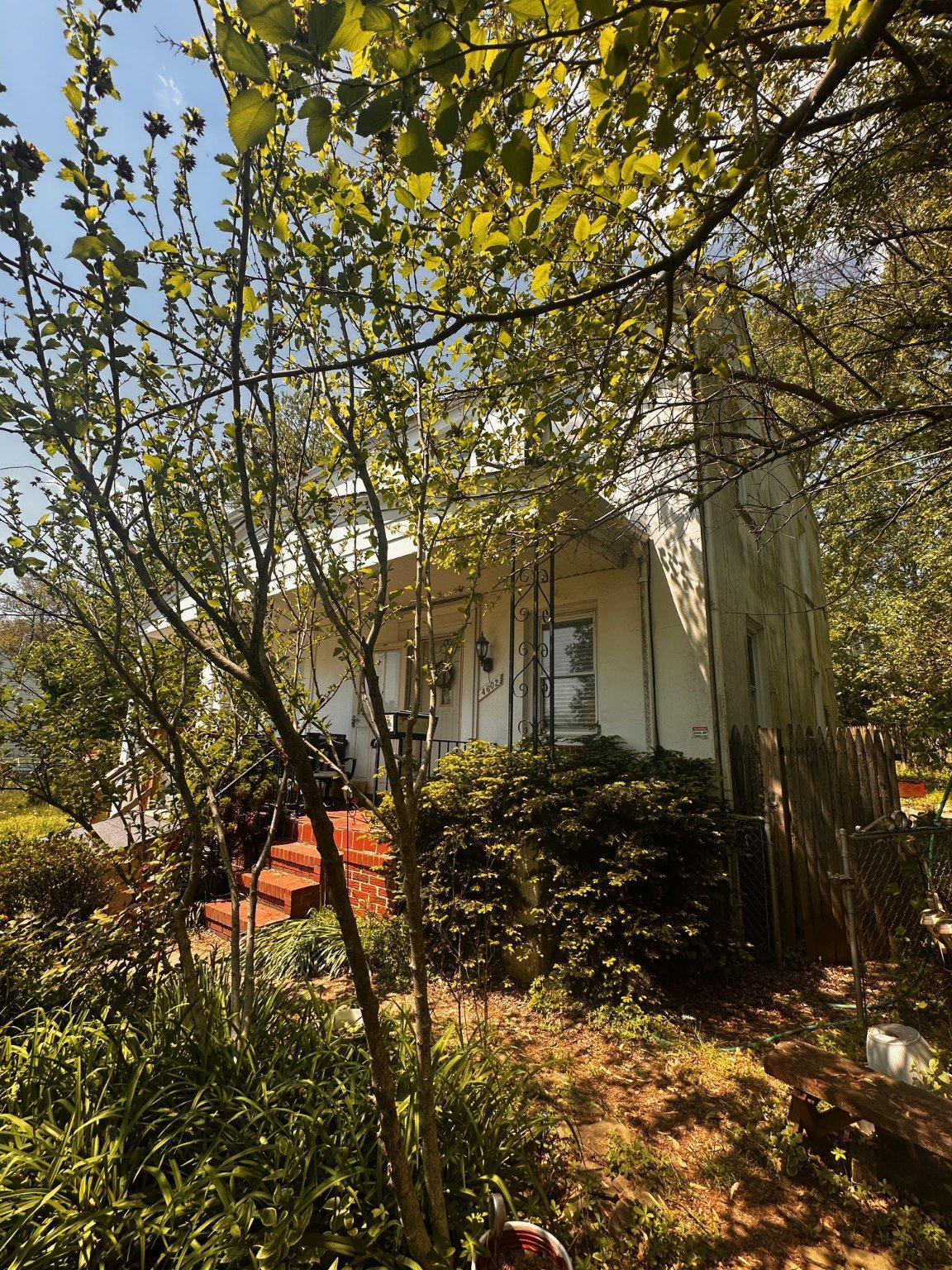 Opportunity awaits for buyers looking to build equity with a little vision and effort. This home is currently configured as a 3-bedroom, 2-bath property, with the original living room converted into a convenient main-level bedroom—easily restored to its original use if desired.

The main level features a galley kitchen with rear access to a covered porch overlooking a fenced and landscaped backyard—perfect for outdoor enjoyment. The property also offers a landscaped front yard designed for ease of maintenance.

Upstairs, you’ll find two comfortable bedrooms and a full hall bath with an oversized shower.

The full lower level offers great expansion potential and includes a laundry and storage area, an unused half bath, and a walk-up stairwell to the rear yard.

Additional highlights include natural gas forced-air heating, central air conditioning, and a natural gas water heater. The home is priced with updates in mind, making it an excellent opportunity for customization.

Seller may require a short rent-back period to transition into their next home, which is already under contract.