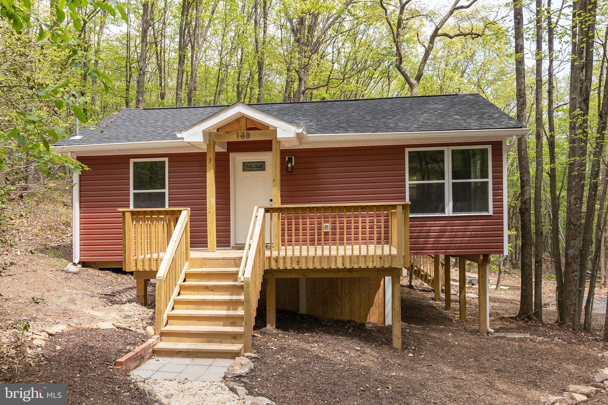 ADORABLE RETREAT IN THE WEST VIRGINIA HILLS.  THIS RECENTLY REMODELED COTTAGE HAS BEEN TASTEFULLY COMPLETED TO SUIT THE NEEDS OF THOSE LOOKING TO ESCAPE THE HUSTLE AND BUSTLE OF A BUSY LIFE.  LOCATED IN A QUIET MOUNTAIN SUBDIVISION AND TUCKED AWAY IN A HOLLOW BESIDE A SEASONAL STREAM, YOU WILL FIND ALL OF THE PEACE AND RELAXATION YOUR HEART COULD DESIRE.  ALSO LOCATED WITHIN WALKING DISTANCE OF THE COMMUNITY ACCESS POINT TO SHORT MOUNTAIN WILDLIFE MANAGEMENT AREA WHICH IS 8000 ACRES OF PUBLIC LAND FOR HUNTING, HIKING, ETC.  EVERYTHING BUT THE FRAMING IS BRAND NEW INCLUDING WELL AND SEPTIC. WITH LESS THAN A 45 MINUTE DRIVE FROM I-81 AND WINCHESTER, VA YOU COULD BE AT YOUR HOME AWAY FROM HOME AND TAKE ADVANTAGE OF THE ENDLESS RECREATIONAL POSSIBILITIES THAT THE MOUNTAIN STATE HAS TO OFFER.  DON'T DELAY, MAKE THE TRIP TO DELRAY TODAY!