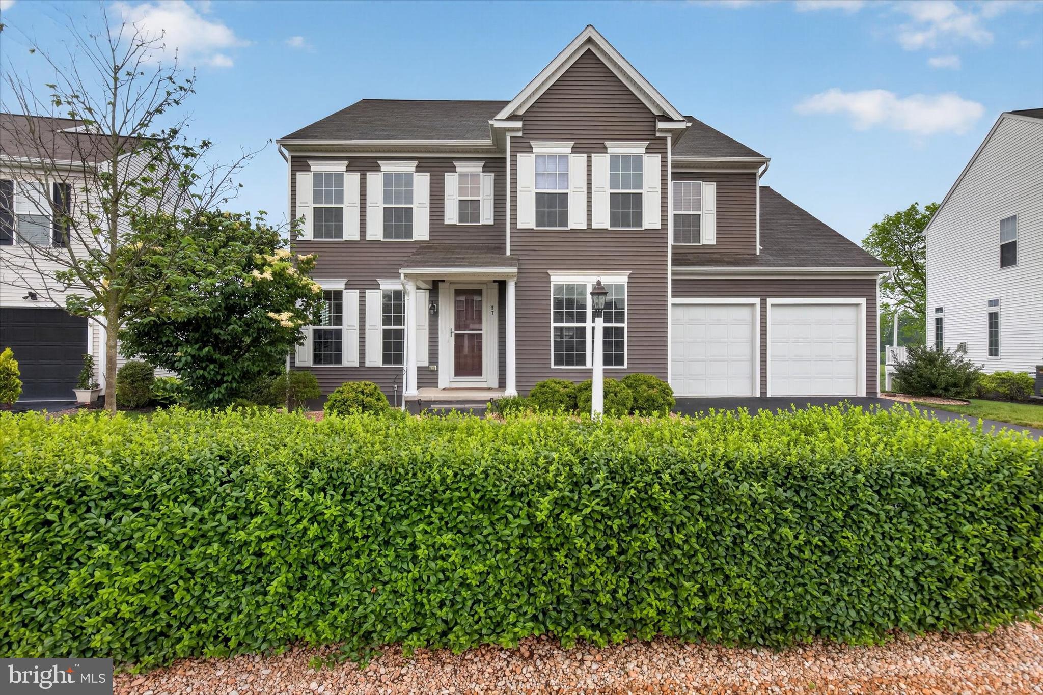 Welcome to Woodbridge, one of Cumberland Valley's most sought-after communities, where thoughtful design, generous living spaces, and exceptional entertaining come together in one stunning home. Offering over 4,600 square feet of finished living space, this 4 bedroom, 3.5 bath home immediately impresses with 9’+ ceilings, abundant natural light, rich hardwood flooring, oversized windows, and a layout designed for both everyday living and memorable gatherings. A private office with French doors and a formal dining room frame the entry, while the heart of the home unfolds into a spacious family room with a tray ceiling, fireplace, and a beautifully appointed kitchen designed for gathering. Dramatic dark cabinetry, granite countertops, a large center island with seating, a brand new gas range, butler's pantry, walk-in pantry, and a bright dining area overlooking the expansive deck create a space that is equally suited for entertaining a crowd or enjoying a quiet morning coffee while taking in the open views behind the home. Just off the kitchen, the mudroom features custom built-in lockers, creating an organized drop zone with convenient access to the oversized epoxy-finished garage with ample room for storage. Upstairs, the massive primary suite feels like a private retreat with room for a sitting area, large walk-in closets, and a spacious bath featuring a dual-sink vanity, soaking tub, and separate tile shower. Three additional bedrooms are generously sized, and the loft provides flexible space for a reading nook, study area, or lounge. The walkout lower level has been updated with new luxury vinyl plank flooring and a reconfigured layout that adds privacy and flexibility. Originally designed to accommodate multi-generational living, this level offers a private bonus room that could serve as a guest suite, home gym, home office, hobby space, or a variety of other lifestyle needs. The entertainment area features a home theater setup with projector, large screen, and tiered theater seating, creating the perfect setting for movie nights, game days, and hosting friends and family. A wet bar/kitchenette with dining space, full bath, and direct access to the patio and fenced backyard further enhance the versatility of this incredible lower level. Outside, enjoy the patio and deck, and beautifully maintained yard with no homes directly behind you, offering a sense of openness rarely found in today's neighborhoods. Additional recent updates include a new Trane HVAC system, including furnace and condenser replacement. Conveniently located just minutes from Carlisle Pike, shopping, dining, major commuter routes, and everyday conveniences, this exceptional home combines space, functionality, and thoughtful updates in one unforgettable package. Schedule your showing today!
