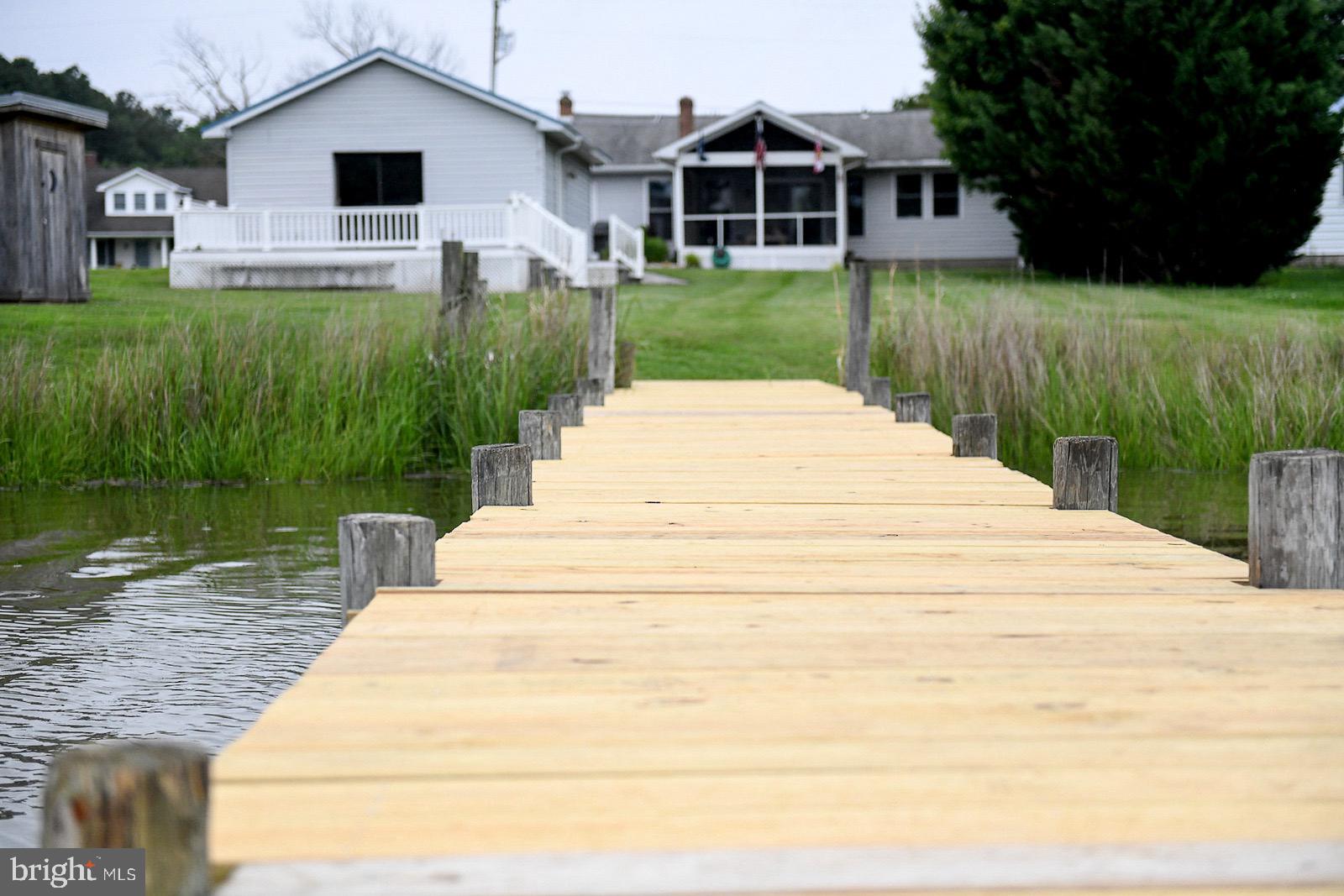 Priced below assessed value!  Current VA Loan could be assumable at under 4%.  Unique waterfront property w/ guest house.  New dock, w/ marine grade lumber and stainless-steel fasteners was raised to be higher than the avg. high tide.  Enjoy crabbing and sunset views from the dock in spring, summer and fall.  Property has 69' of shoreline with 2' at low tide and 4-5' at high tide.  Open concept floor plan w/ lots of light and water views. 2 BR, 1.5 bath and bonus room/office. Upgraded modern kitchen with stainless appliances, new counter tops and farmhouse sink.  Newer, 3–4-year-old wifi connected HVAC and solar panels that are owned and will be transferred at sale.  Large, bug free screened porch.  The electric bill is only $850/year (not per month!) for the current owners. The guest house has a spacious living, sleeping, kitchen area, a full bath, a large deck and a new metal roof.  New wifi enabled minisplit for heating and cooling.  Live a multigenerational lifestyle on the water like none other. Hard scape and walk ways just completed along with interior paint and new carpet in the main living room.  Property is within 2-3 miles from St. Clements Island & Museum, minutes away from area marinas, and about 5 min boat ride to reach the Potomac River.  The creek is in the rear of the property and flood insurance not required.