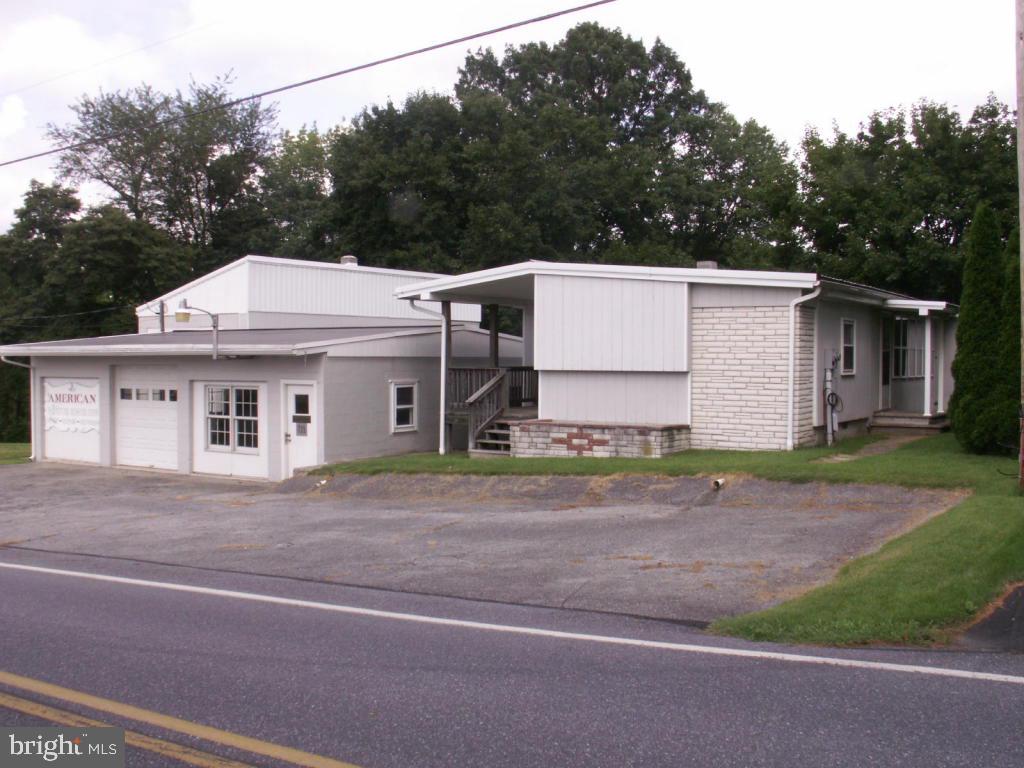 This property consists of a 4 bay garage/shop area and a 604 Sq. ft. mobile home that needs interior work. Perfect fixer upper for someone who is handy! A Special Exception from the Zoning Hearing Board will be required unless buyer wants to use it for a low/no impact home business. Please refer to OS-Woodland District zoning in Documents.