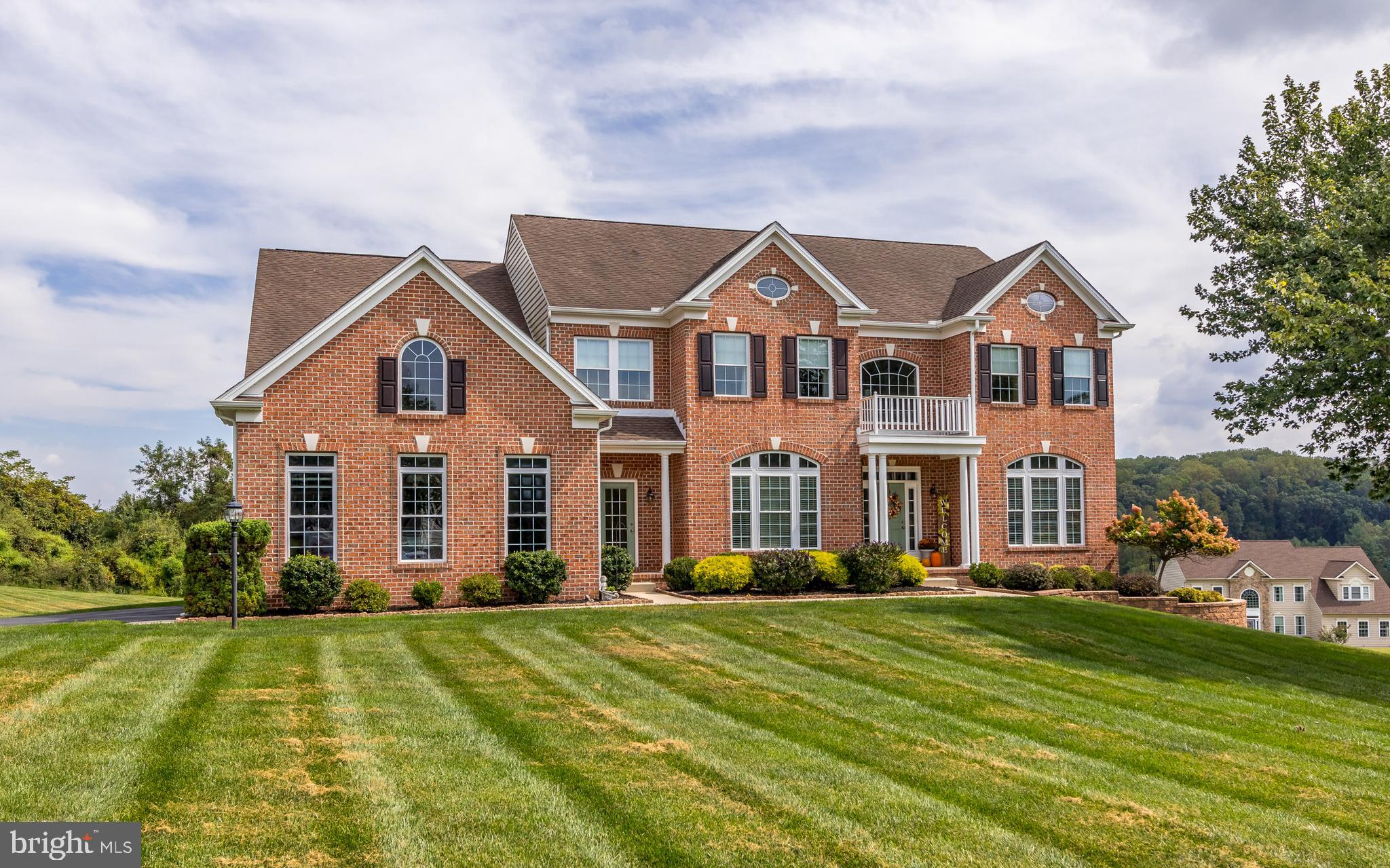 Introducing 1205 Bear Hollow Ct – this stunning brick front home is  located in the highly sought-after and prestigious Water Vale Farm neighborhood in Forest Hill*Offering 4 generously sized bedrooms, 3.5 well-appointed bathrooms, a spacious 3-car side-load garage and over 4800 sq ft of finished living space*Nestled on a breathtaking 5.13-acre lot at the end of a quiet cul-de-sac, it provides the perfect blend of privacy and elegance*As you enter through the spacious foyer, you are welcomed by an elegant formal living and dining room, complete with a butler’s pantry for seamless entertaining.*The main level also features a private office, a generously sized kitchen with a separate wall of cabinetry that can serve as a wet bar, coffee station, or buffet area*Enjoy the sunlit solarium—perfect for morning coffee or quiet reading—and relax in the expansive family room with a cozy gas fireplace. Two staircases provide both convenience and architectural charm*The upper level features a luxurious primary suite complete with two walk-in closets, an additional standard closet, a private sitting room, and an en-suite bathroom with dual vanities, a soaking tub, and a separate shower. Three additional generously sized bedrooms are also located on this level—two of which include their own full bathrooms and walk-in closets*The spacious unfinished lower level offers a rough-in for a full bathroom, a newer HVAC system, updated well tank, water treatment system, and walk-out access to the beautiful backyard—ready for your finishing touches*Lovingly maintained and in pristine condition, this home is ready to welcome its new owners.