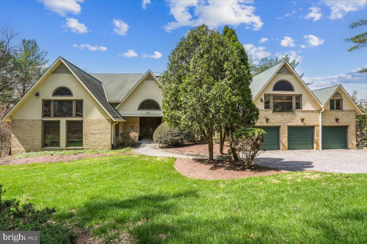Sited on 2.3 acres near Potomac Village on a quiet street sits this estate home with a contemporary flair. This  elegant home welcomes you with a sun-filled, multi story atrium foyer complete with a glass elevator. Truly a Home for All Seasons. 
This sunny skylit home comes with 5 spacious bedrooms, 8.5 baths, 3 fireplaces, and a 3-car garage. The home has a total living space of over 11,000 sq. ft. of which the above grade space is over 7,400 sq. ft . This home offers room to live, work and entertain with ease. A generous upper level office provides an ideal retreat for work or creativity. 
The main-level owner's suite features a spacious bedroom with 2 full bathrooms with a relaxing spa tub and sauna - a true sanctuary at the end of the stressful day. 
At the heart of the home, the chef's gourmet kitchen shines with high-end appliances (Sub-zero refrigerator, Wolf stove/range, luxurious wine refrigerator), quartz  island and counters, walk-in pantry and multiple picture windows that frame views of the back yard and woods. From here step out to the expansive deck, perfect for morning coffee, outdoor dining or hosting gatherings. Adjacent to the  kitchen is a  Study/Den with a fireplace. The main level has an  elegant living room, a  spacious dining room and a dramatic two-story family room that creates warm and welcoming spaces for everyday living and memorable celebrations. The home is equipped with a 5-zone HVAC system for enhanced comfort and efficiency.
The upper level has 4 spacious bedrooms each of them with its own updated full bath. Also located on the upper level is the laundry room with Washer and Dryer. The dramatic  Skylights provide tons of light to the entire house.
The fully finished walkout lower level is an entertainer's dream, featuring a heated lavish indoor pool, a large recreation hall, and a meeting area with an integrated audio-visual system and a wet bar - ideal for movie nights, parties, or hosting guests in style. Also located at this level is a full bath and a Cedar closet.
This home is located close to top rated pubic and private schools, shops and restaurants, and 2 acclaimed golf courses. 
This home is perfect for all stages of life and a Home for All Seasons.