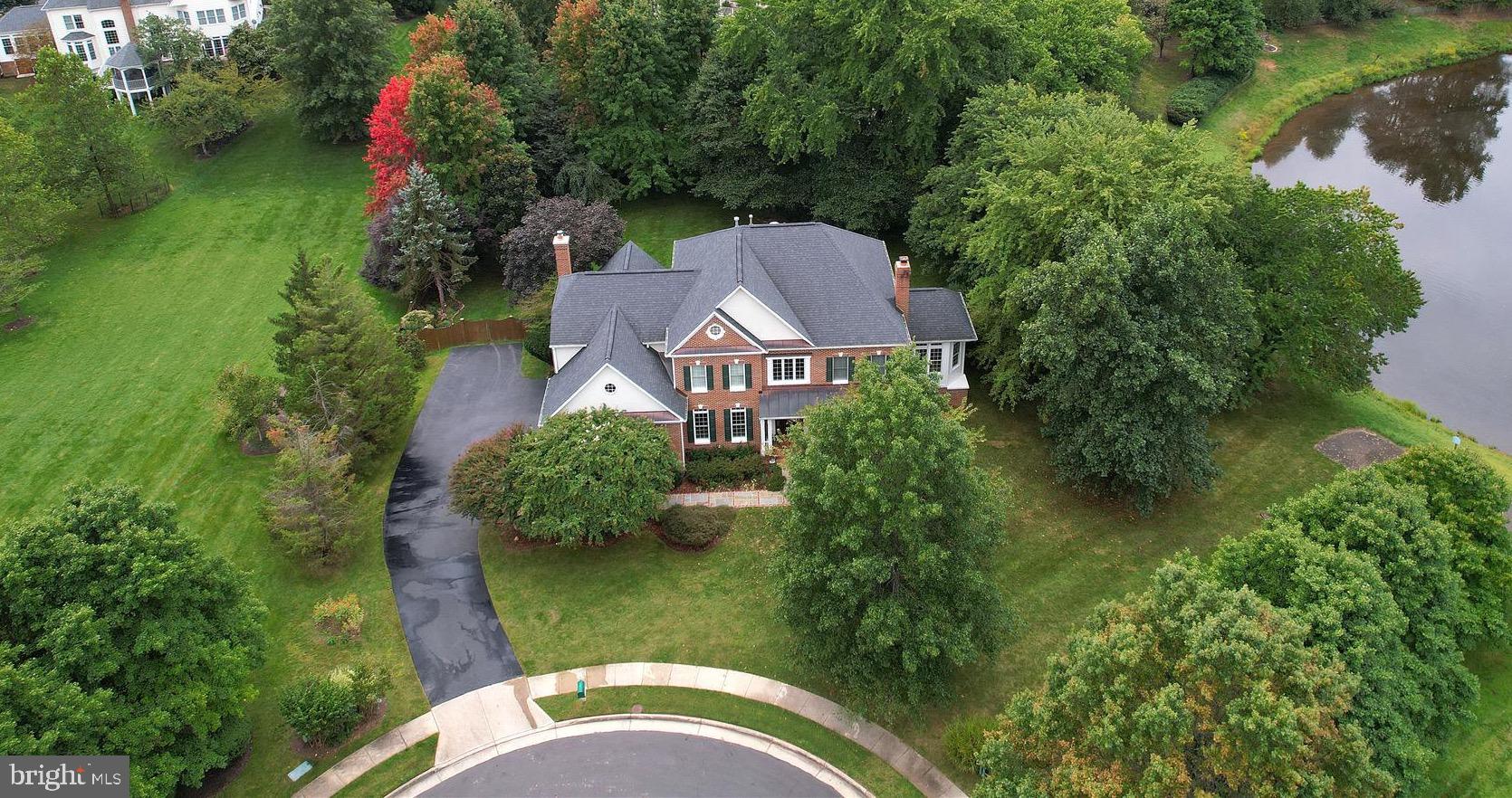 Have you been waiting for just the right property?  The one you thought didn't exist - your dream home on the perfect lot in coveted Oak Hill Estates.  Your opportunity is finally here!  Rarely do homes become available in this charming, tree-lined neighborhood which feeds to the highly desirable Navy/Franklin/Oakton pyramid.  This quality built Winchester Belmont model offers timeless beauty and exceptional curb appeal with an inviting front porch that overlooks the cul-de-sac and offers views of the pond.  Nature lovers will appreciate that the home is a designated Audubon at Home Wildlife Sanctuary and a Monarch Waystation.  An outdoor enthusiasts paradise - the fully fenced, landscaped backyard offers an array of native plants and peaceful spaces for relaxing and enjoying the outdoors.  Equally appealing are the light and bright indoor spaces.  The flowing floorplan is ideal and features a gourmet kitchen that opens  to a spacious family room with a cozy wood burning fireplace, vaulted ceilings and French doors leading to a spectacular screened deck overlooking the .89 acre flat lot.  The main level also features dual staircases, an elegant living room with gas fireplace and dining room with bay window, a large library that is perfect for work-from-home, and a sun drenched solarium overlooking the pond.  The upper level boasts the sought after 4 bedroom, 3 bath configuration including a wonderful primary suite with renovated bathroom and a huge walk-in closet with custom cabinetry.  The walk out lower level is a fantastic recreational space with a billiards room, gym and in-law suite with full bath.  French doors lead to the slate patio with hot tub, or if desired, the yard can accomodate a large pool.  You will enjoy the privacy and walkability of Oak Hill Estates, an enclave of gracious homes sited on 3/4 acre+ lots, and all cul-de-sac streets offering the utmost in privacy yet with a warm, community feel.  Prime location with easy access to major commuter routes (50, 66, 267), Dulles Airport, the Silver Line Metro, and minutes to shopping and restaurants at Reston Town Center and Fairfax Corner.